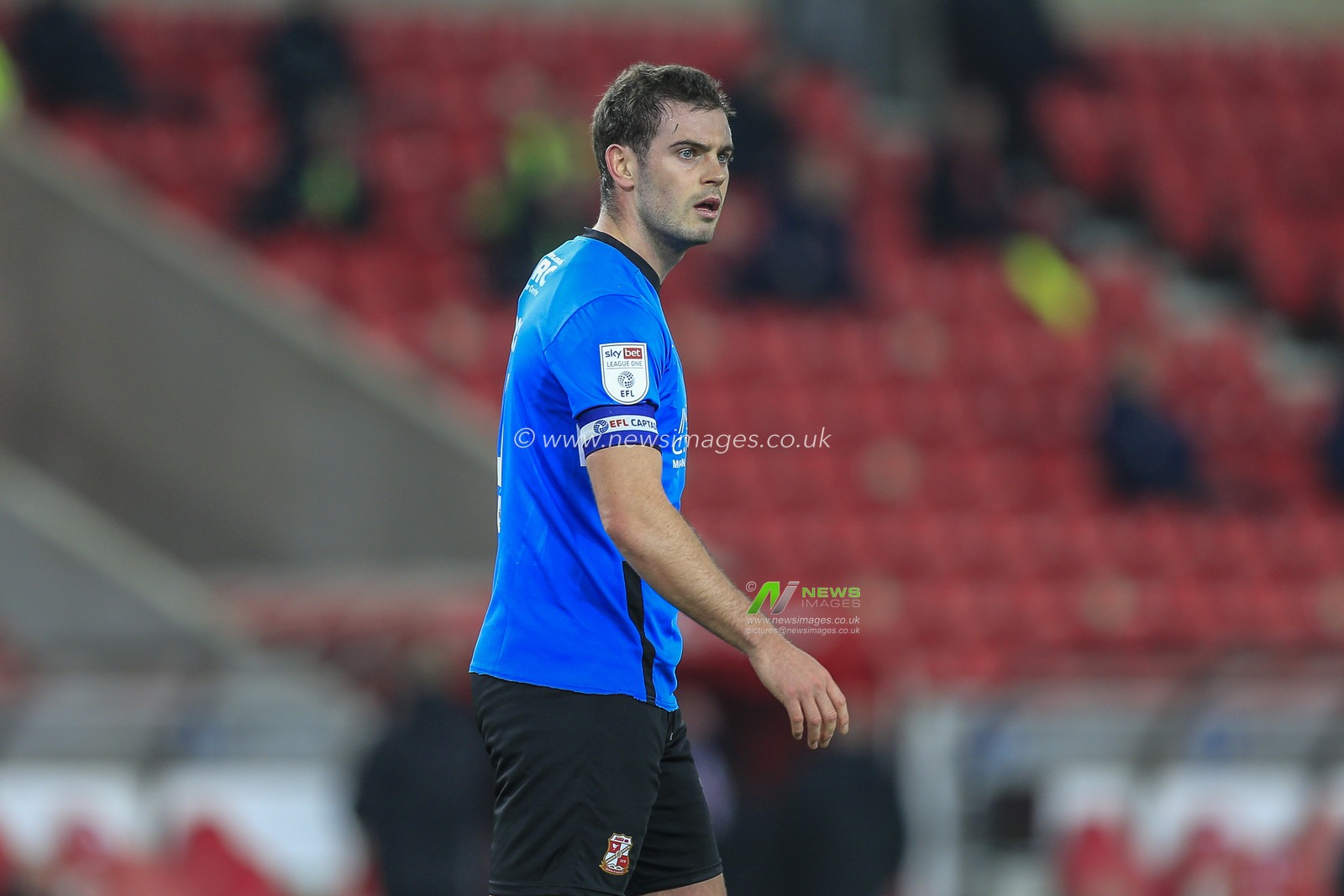 Dion Conroy #4 of Swindon Town during the game