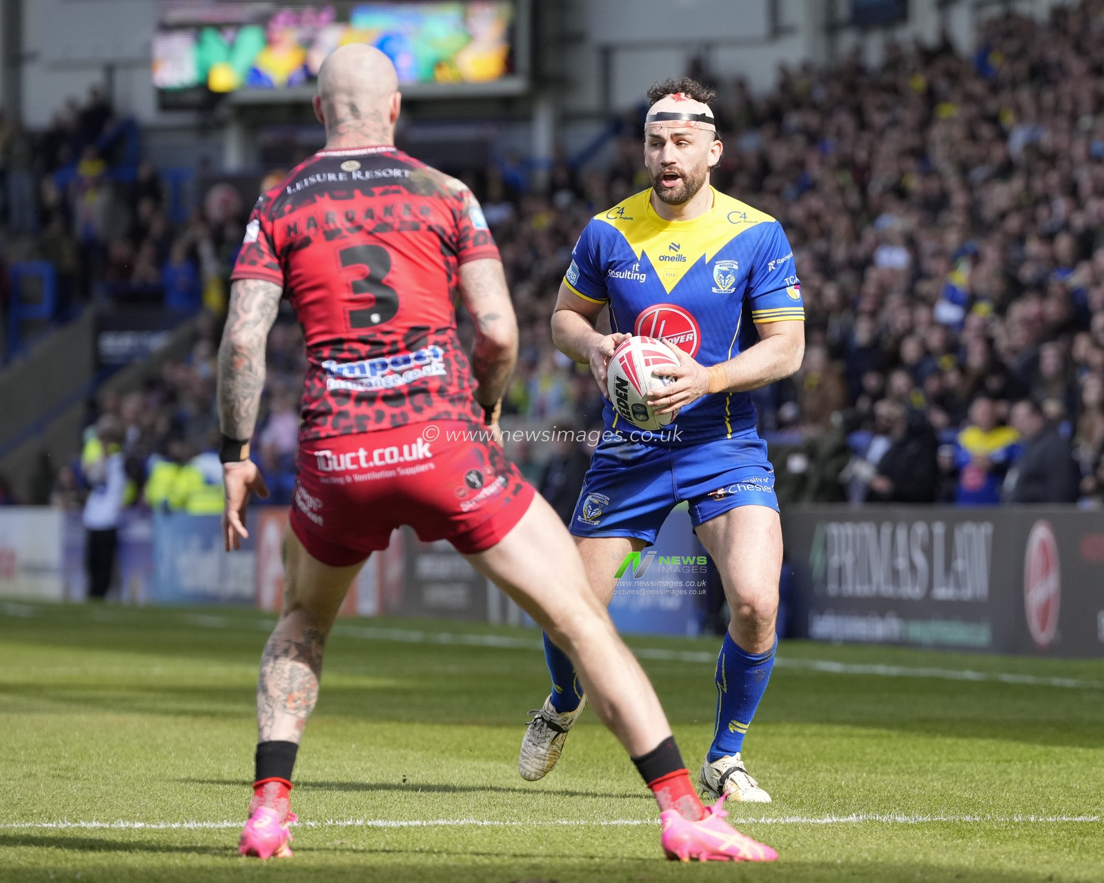 Toby King of Warrington Wolves runs at Zak Hardaker of Leigh Leopards during the Betfred Super League Round 8 match Warrington Wolves vs Leigh Leopards at Halliwell Jones Stadium, Warrington, United Kingdom, 20th April 2024

(Photo by Steve Flynn/News Images)