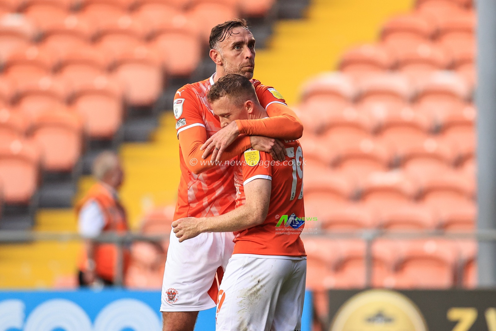 Shayne Lavery #19 of Blackpool celebrates his goal to make it 1-0 with Richard Keogh #26 of Blackpool