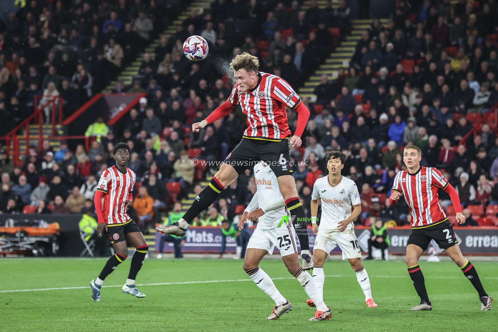 Harry Souttar of Sheffield United heads the ball clear from a corner during the Sky Bet Championship match Sheffield United vs Swansea City at Bramall Lane, Sheffield, United Kingdom, 2nd October 2024

(Photo by Alfie Cosgrove/News Images)