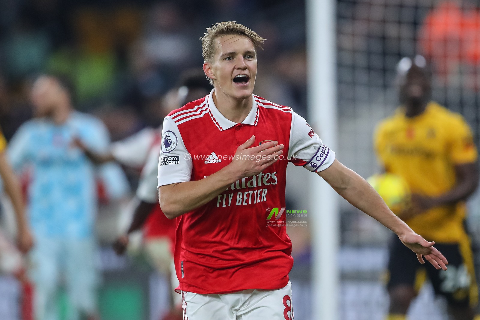 Martin Ã˜degaard #8 of Arsenal celebrates his goal to make it 0-1 during the Premier League match Wolverhampton Wanderers vs Arsenal at Molineux, Wolverhampton, United Kingdom, 12th November 2022

(Photo by Gareth Evans/News Images)