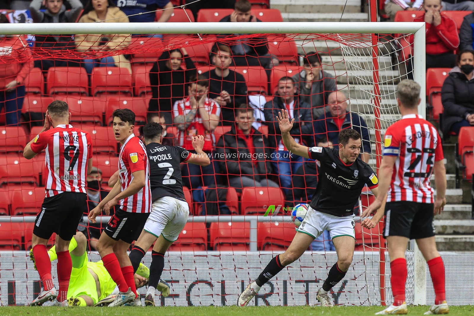 Tom Hopper #9 of Lincoln City celebrates his goal to make it 2-1