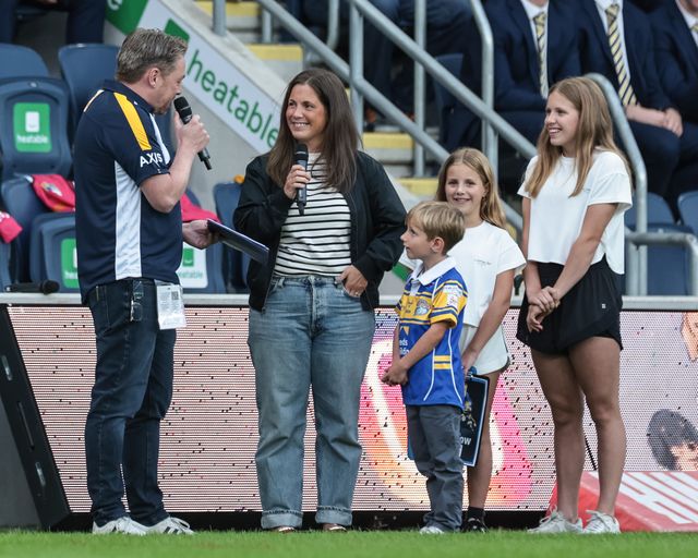 Lyndsey Burrow the wife of Rob Burrow who sadly passed away with MND is in attendance with their three children Macy, Maya and Jackson Burrow as she’s speaks about voting for Rob Burrow's third and final documentary as it has made the final five for the National TV Awards during the Betfred Super League round 23 match Leeds Rhinos vs Hull KR at Headingley Stadium, Leeds, United Kingdom, 21st August 2025

(Photo by Mark Cosgrove/News Images)