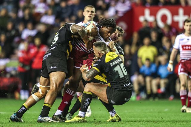 Junior Nsemba of Wigan Warriors is tackled by Paul Vaughan of York Knights and Xavier Va'a of York Knights during the Betfred Super League round 5 match Wigan Warriors vs York Knights at The Brick Community Stadium, Wigan, United Kingdom on 19 March 2026

(Photo by Alfie Cosgrove/News Images)