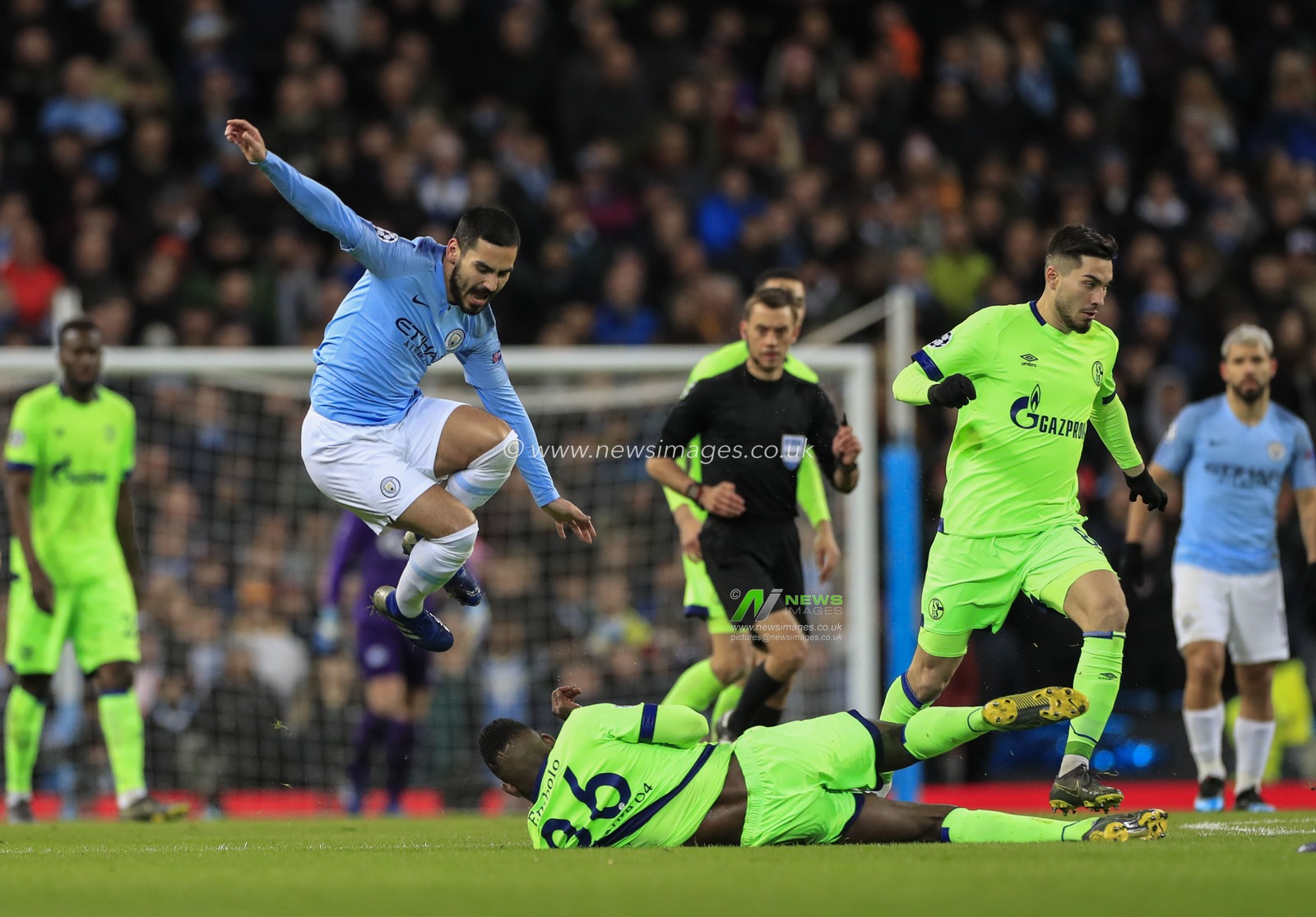 12th March 2019 , Etihad Stadium, Manchester, England; UEFA Champions League, Round of 16, Manchester City v Schalke ;Ilkay Gundogan (08) of Manchester City is fouled by Breel Embolo (36) of FC Schalke

Credit: Conor Molloy/News Images