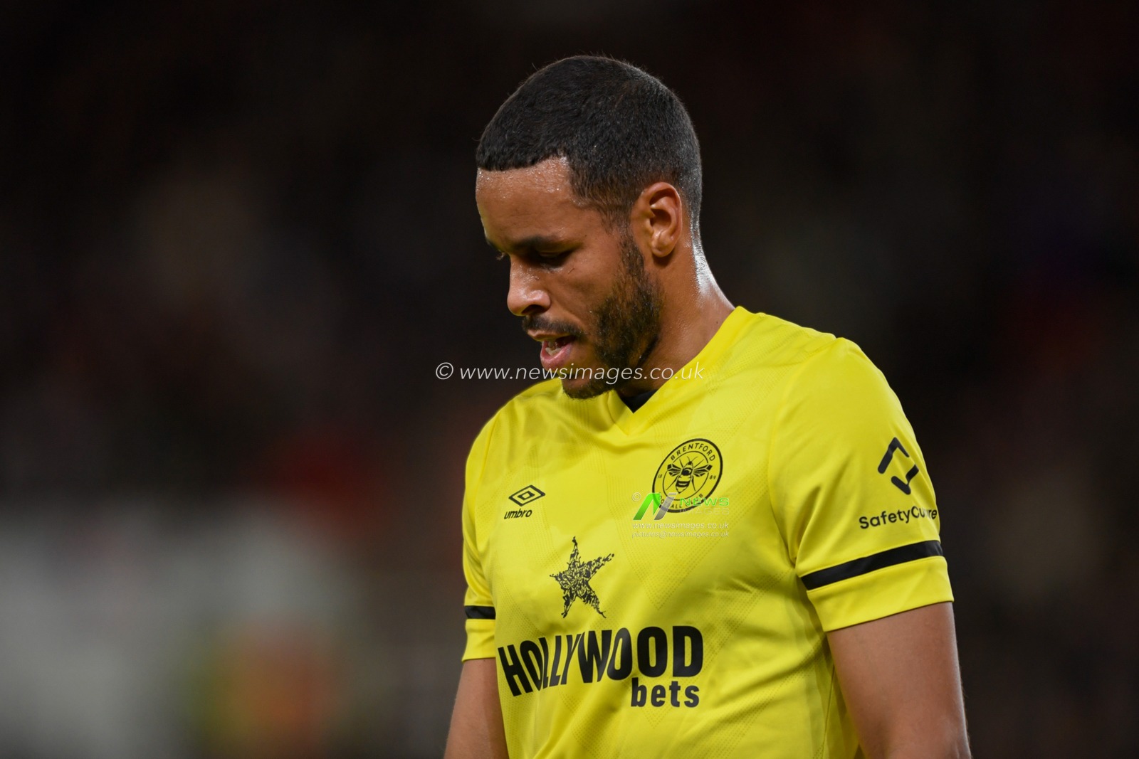 Mathias Zanka Jorgensen #22 of Brentford looks down at the ground