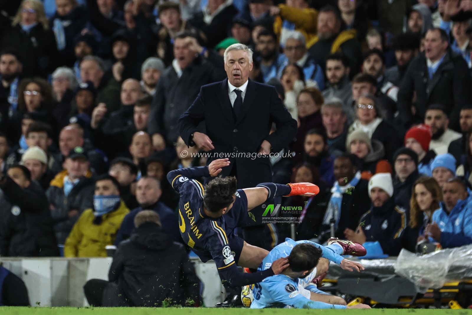 Carlo Ancelotti manager of Real Madrid looks over as Bernardo Silva of Manchester City is fouled by Brahim DÃ­az of Real Madrid during the UEFA Champions League Quarter Final Manchester City vs Real Madrid at Etihad Stadium, Manchester, United Kingdom, 17th April 2024

(Photo by Mark Cosgrove/News Images)