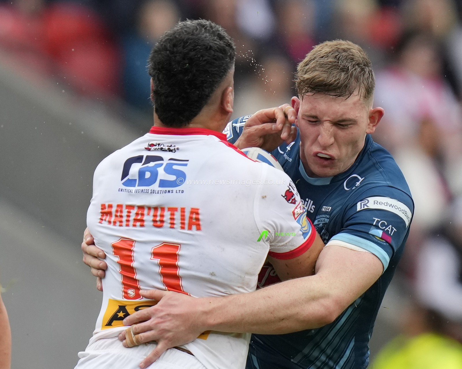 Matty Nicholson #12 of Warrington Wolves tackles Sione Mataâ€™utia #11 of St. Helens during the Betfred Super League Eliminator match St Helens vs Warrington Wolves at Totally Wicked Stadium, St Helens, United Kingdom, 30th September 2023

(Photo by Steve Flynn/News Images)