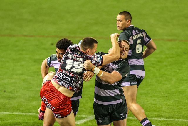Innes Senior of Leigh Leopards is tackled by Asher O'Donnell of Huddersfield Giants during the Betfred Super League round 9 match Leigh Leopards vs Huddersfield Giants at Leigh Sports Village, Leigh, United Kingdom on 23 April 2026

(Photo by Alfie Cosgrove/News Images)