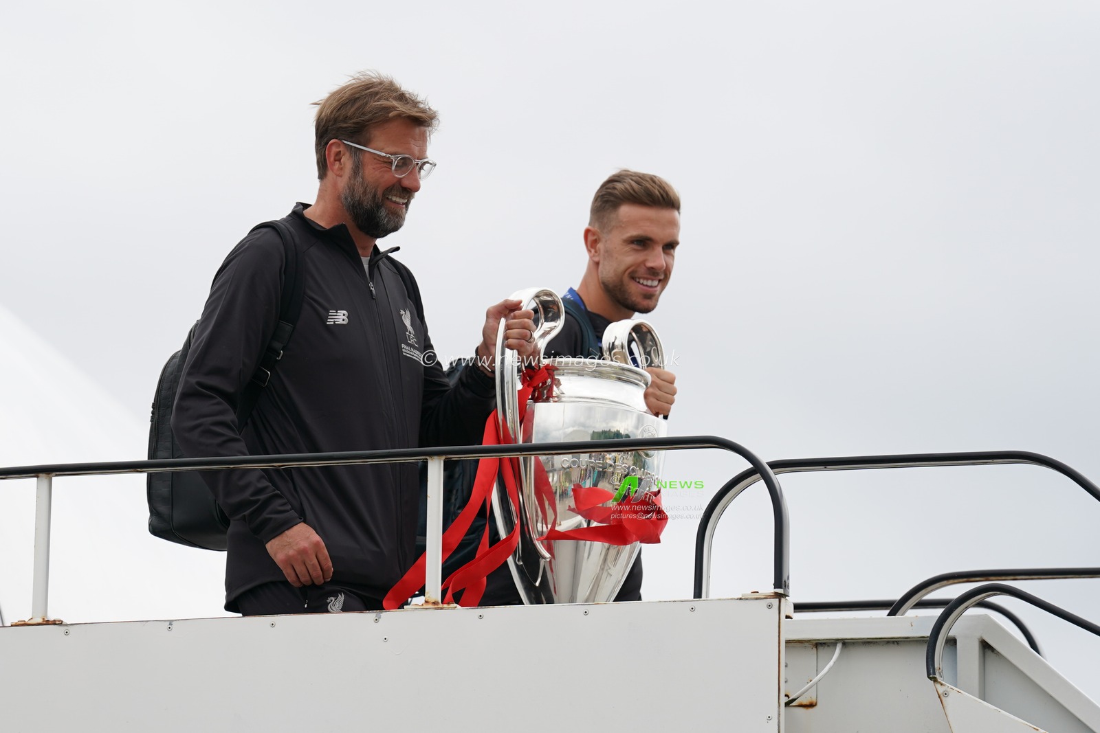 Liverpool manager Jurgen Klopp and Jordan Henderson leave the airplane carrying the European Cup


2nd June 2019 , Liverpool, England; UEFA Champions League, Liverpool FC Champions League winners celebrations and open top bus parade ; 


Credit: Terry Donnelly/News Images