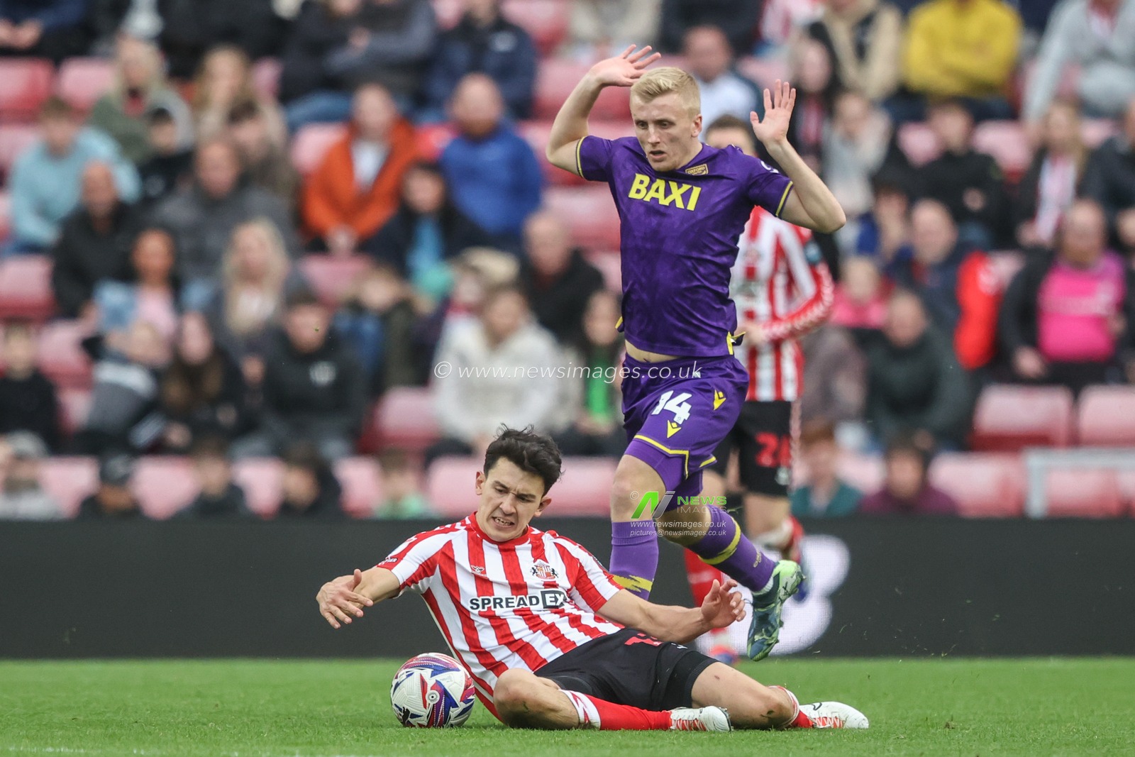 Luke O'Nien of Sunderland is fouled by Louie Sibley of Oxford United during the Sky Bet Championship match Sunderland vs Oxford United at Stadium Of Light, Sunderland, United Kingdom, 26th October 2024

(Photo by Alfie Cosgrove/News Images)
