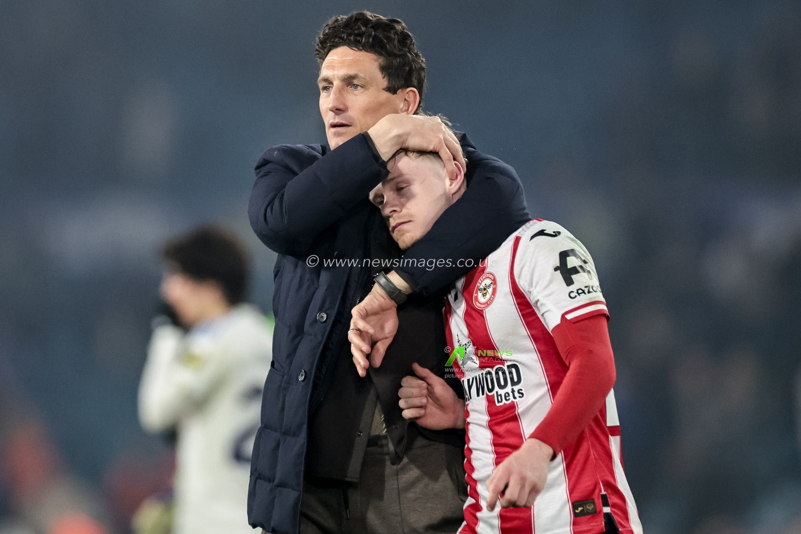 Keith Andrews manager of Brentford embraces Keane Lewis-Potter of Brentford during the Premier League match Leeds United vs Brentford at Elland Road, Leeds, United Kingdom on 21 March 2026

(Photo by Mark Cosgrove/News Images)