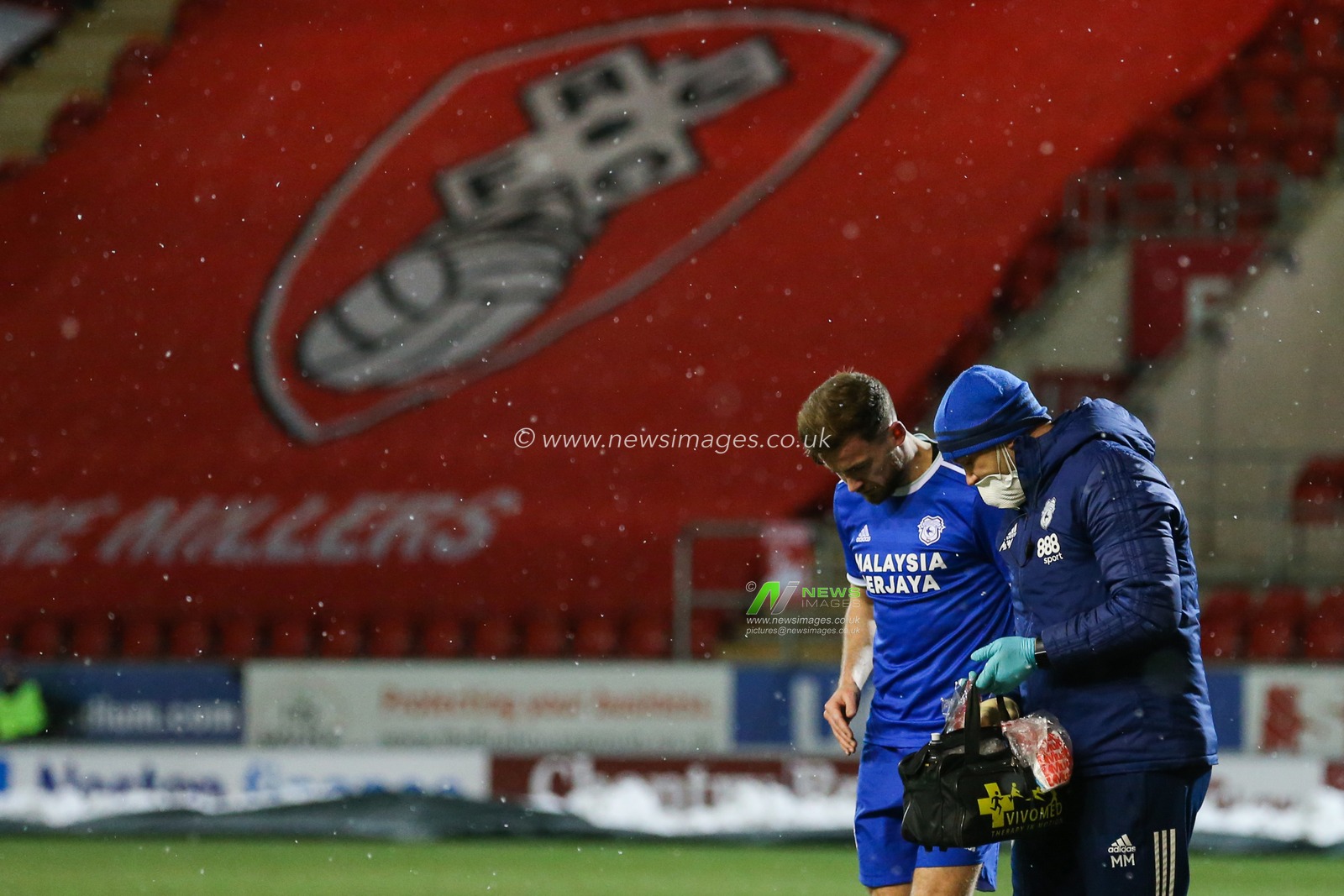 Joe Ralls #8 of Cardiff City receives treatment during the game