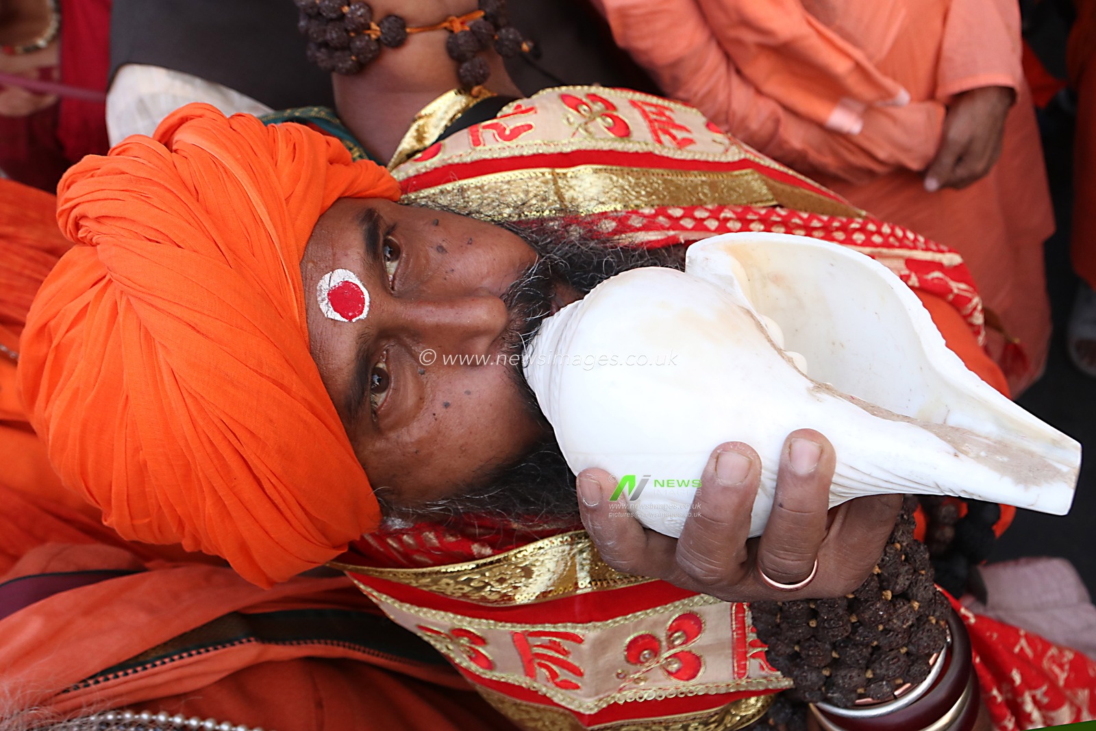A Hindu monk or Sadhu beats a percussion and blows conch shell as he attends a protest rally to stop the atrocities against Bangladesh's Hindu minority community, in Kolkata on December 6, 2024.Pictures by  Debajyoti Chakraborty.(Photo: Debajyoti Chakraborty/News Images)