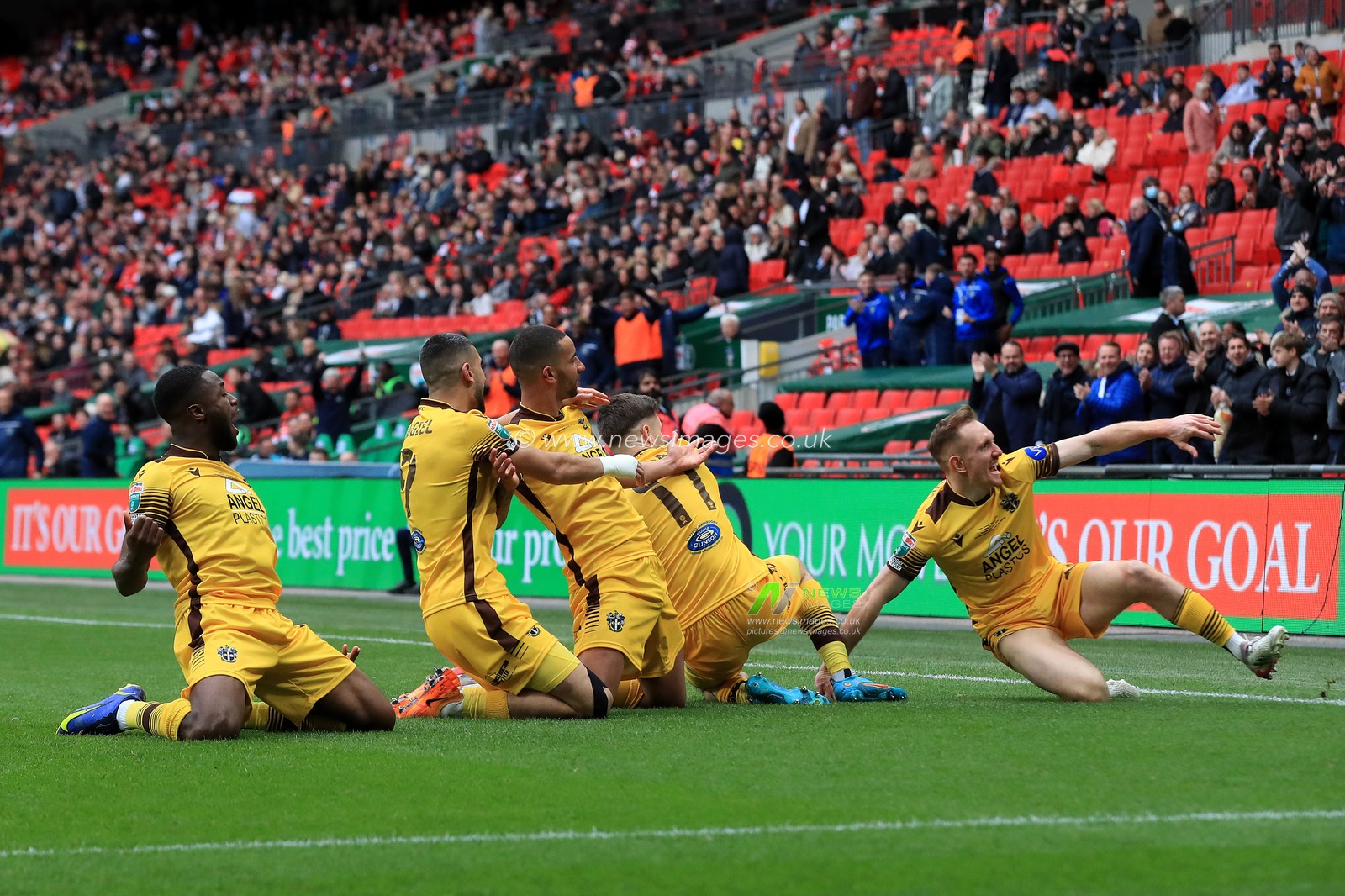 GOAL: Craig Eastmond #15 of Sutton United celebrates scoring with team mates.