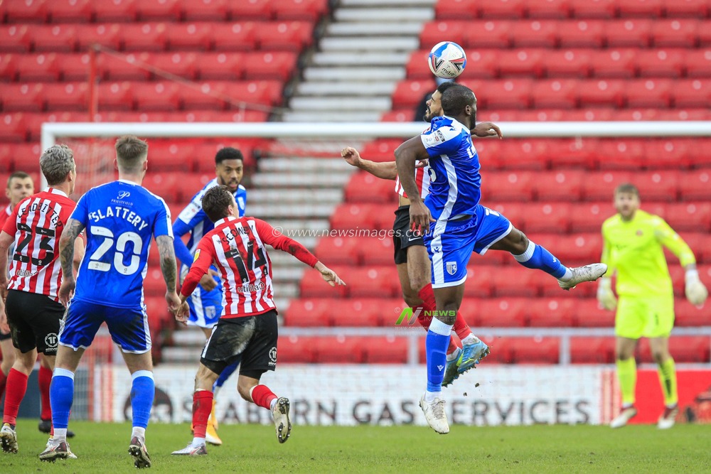 Jordan Willis #4 of Sunderland in an aerial challenge with Ryan Jackson #2 of Gillingham