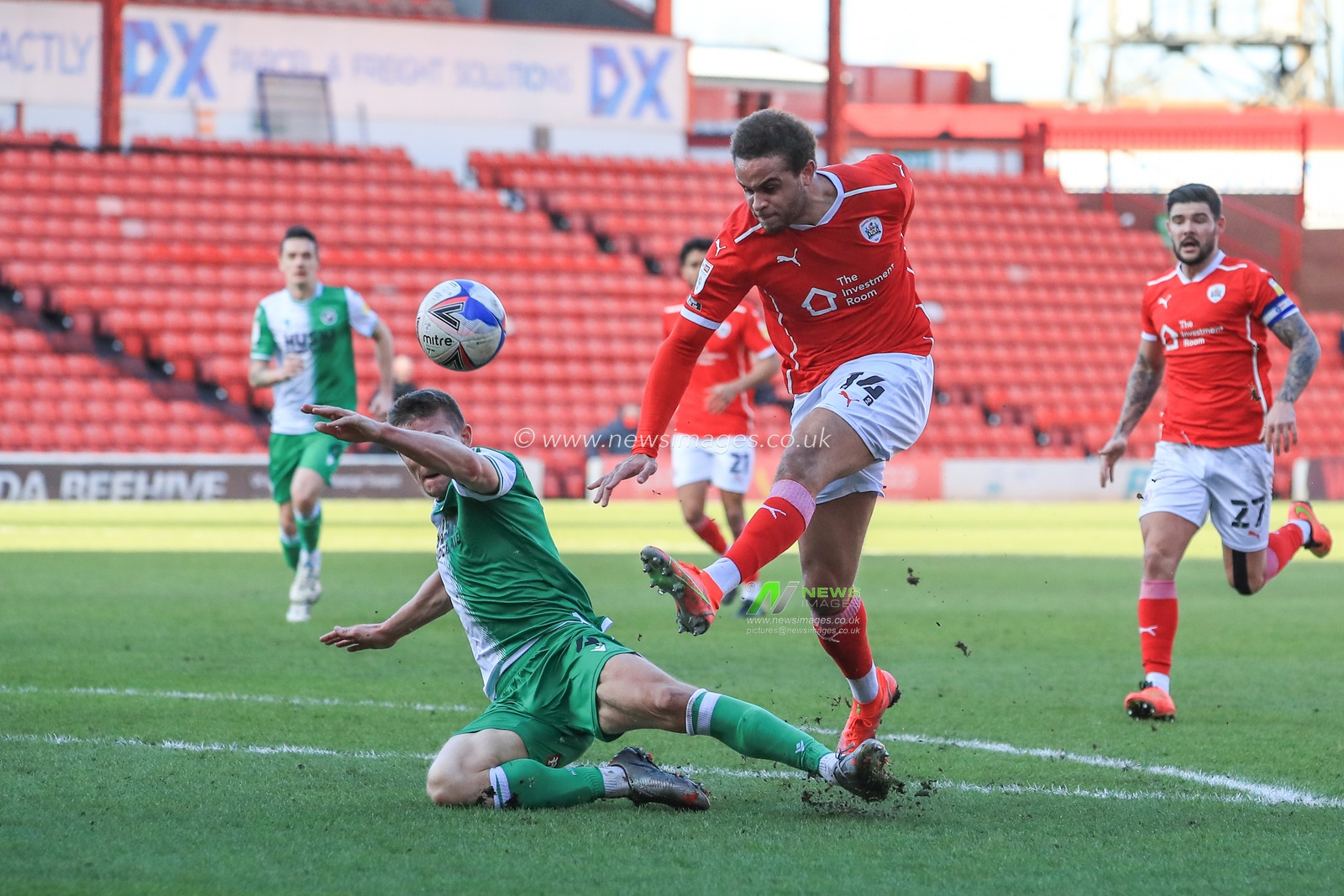Carlton Morris #14 of Barnsley sees his shot on goal pushed our for a corner by Bartosz BiaÅ‚kowski #33 of Millwall