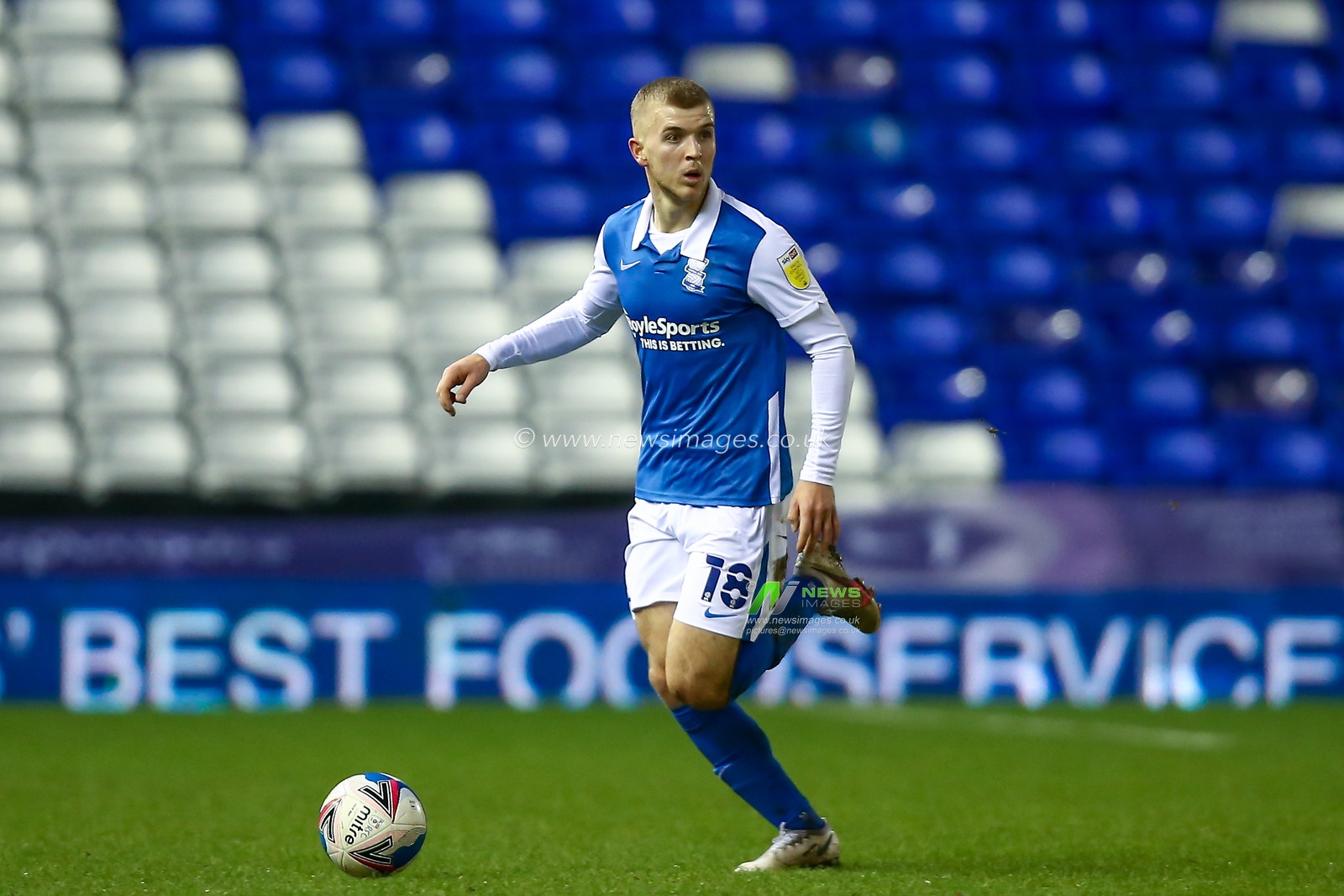 Riley McGree #18 of Birmingham City dribbles the ball