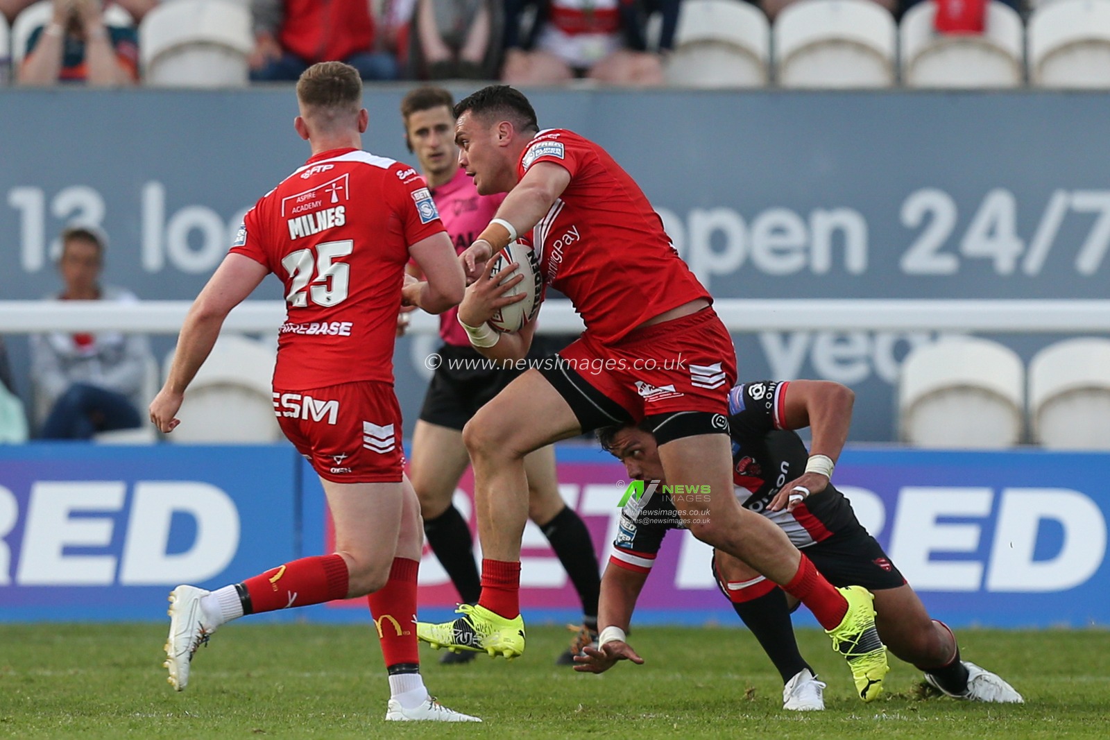 Brad Takairangi (11) of Hull KR runs with the ball