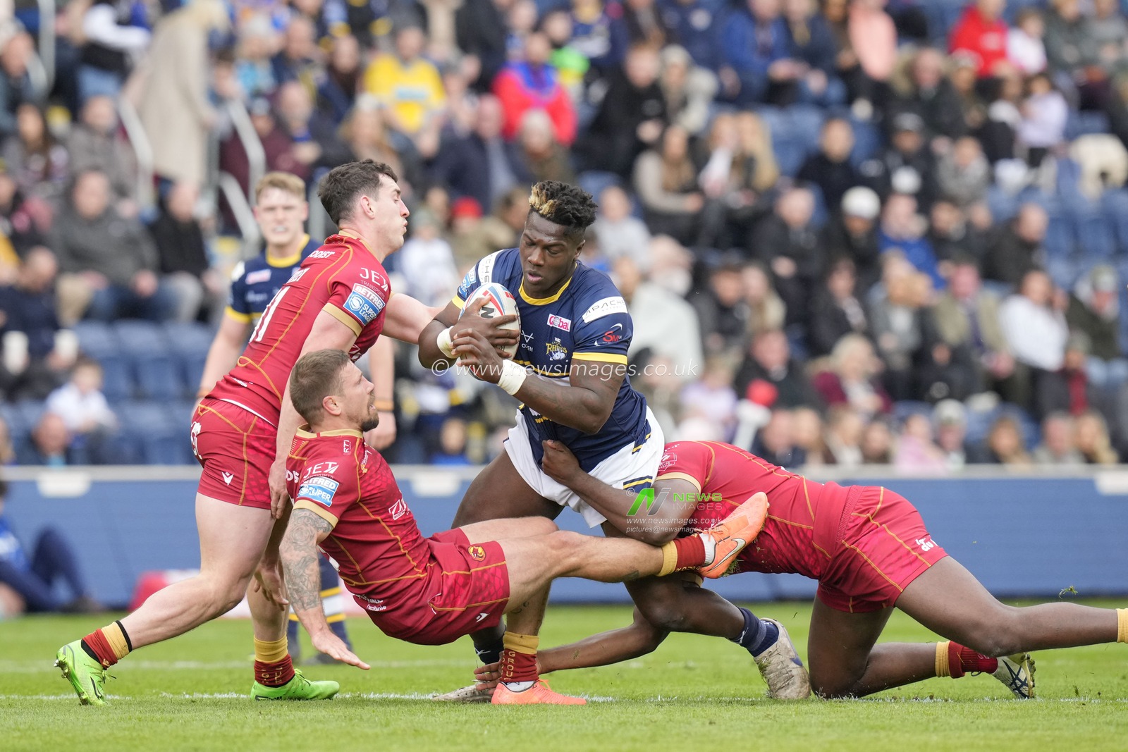 Justin Sangare #17 of Leeds Rhinos drives into Michael McIlorum #9 of Catalans Dragons during the Betfred Super League Round 6 match Leeds Rhinos vs Catalans Dragons at Headingley Stadium, Leeds, United Kingdom, 25th March 2023

(Photo by Steve Flynn/News Images)