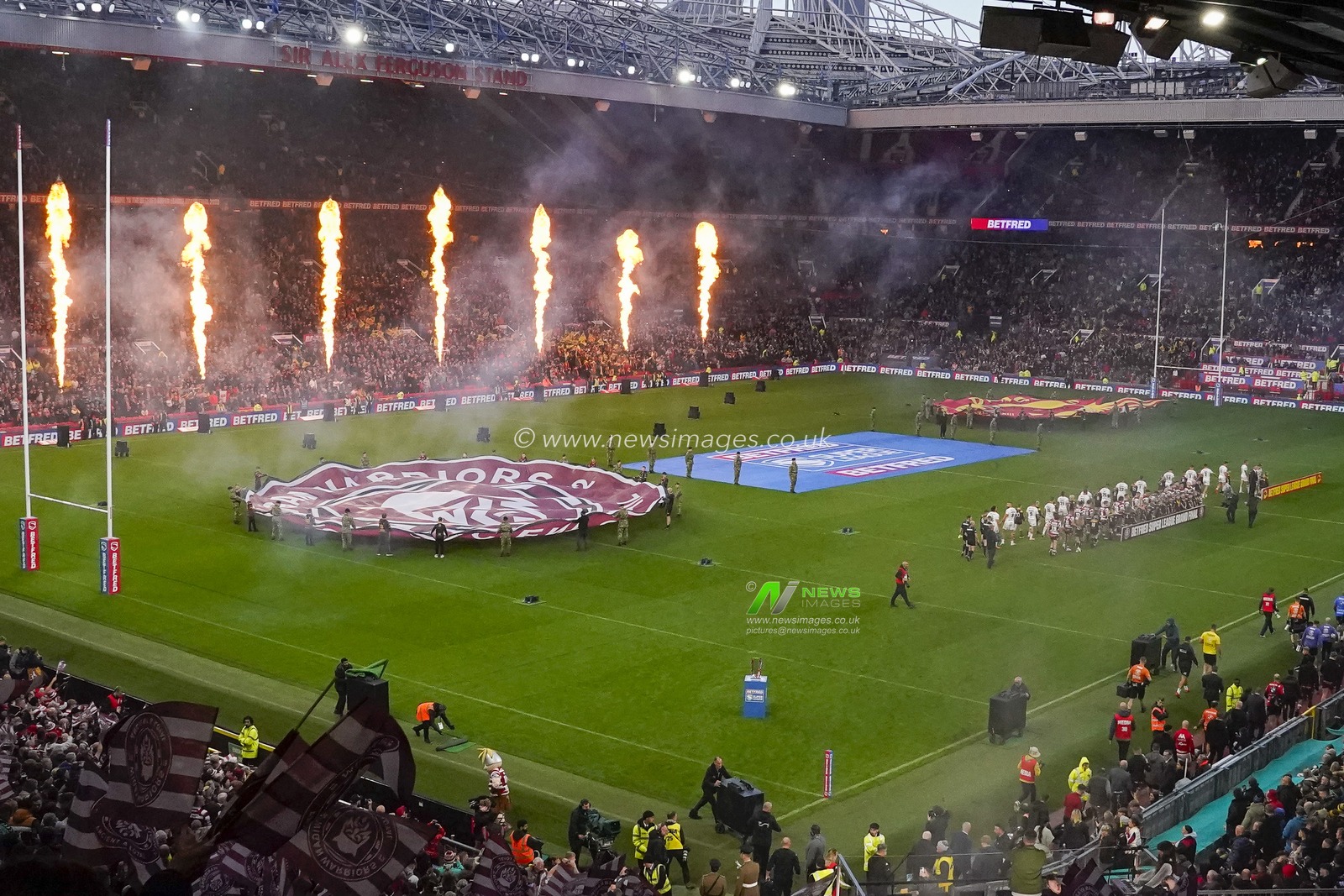 The players walk out to pyrotechnics before the Betfred Super League Grand Final match Wigan Warriors vs Catalans Dragons at Old Trafford, Manchester, United Kingdom, 14th October 2023

(Photo by Steve Flynn/News Images)