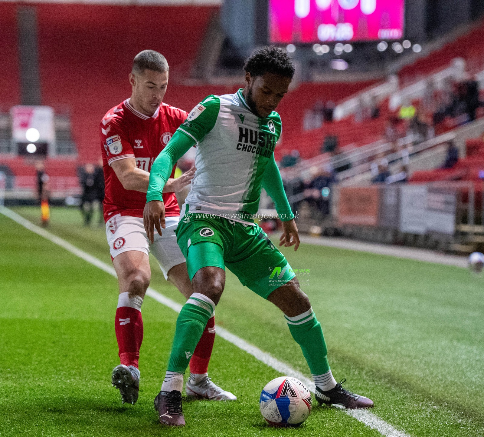 Mahlon Romeo #2 of Millwall shields the ball from Tommy Rowe #25 of Bristol City