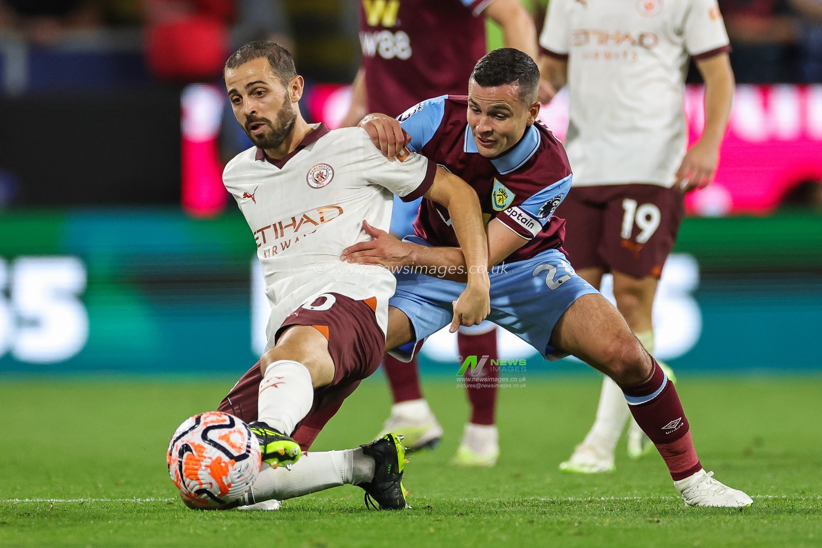 Bernardo Silva of Manchester City and Josh Cullen of Burnley battle for the ball during the Premier League match Burnley vs Manchester City at Turf Moor, Burnley, United Kingdom, 11th August 2023

(Photo by Mark Cosgrove/News Images)