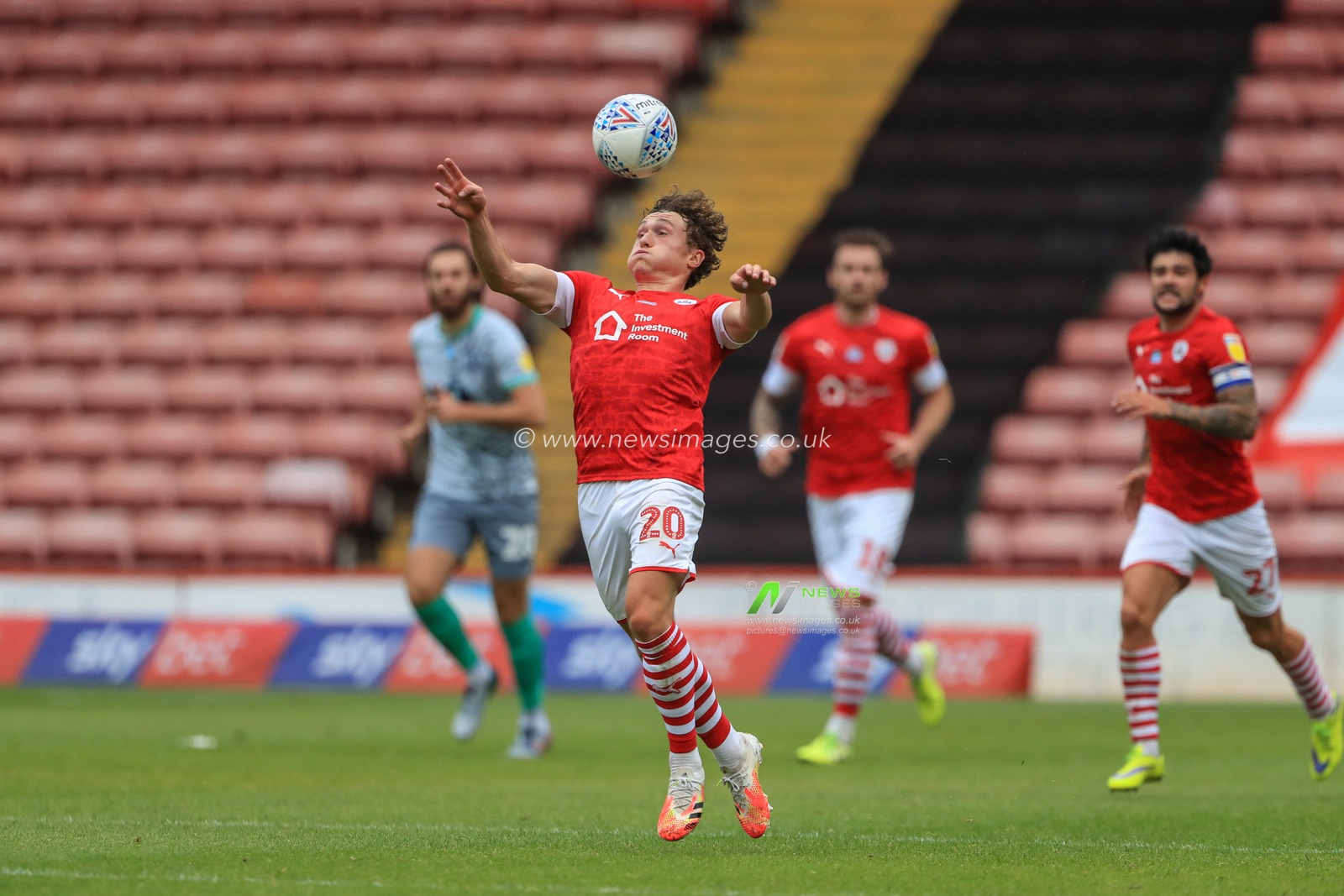 Callum Styles (20) of Barnsley controls the ball