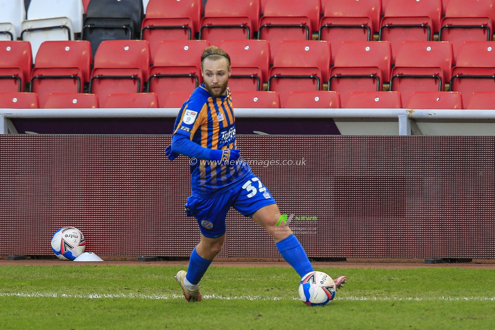 Harry Chapman #32 of Shrewsbury Town with the ball