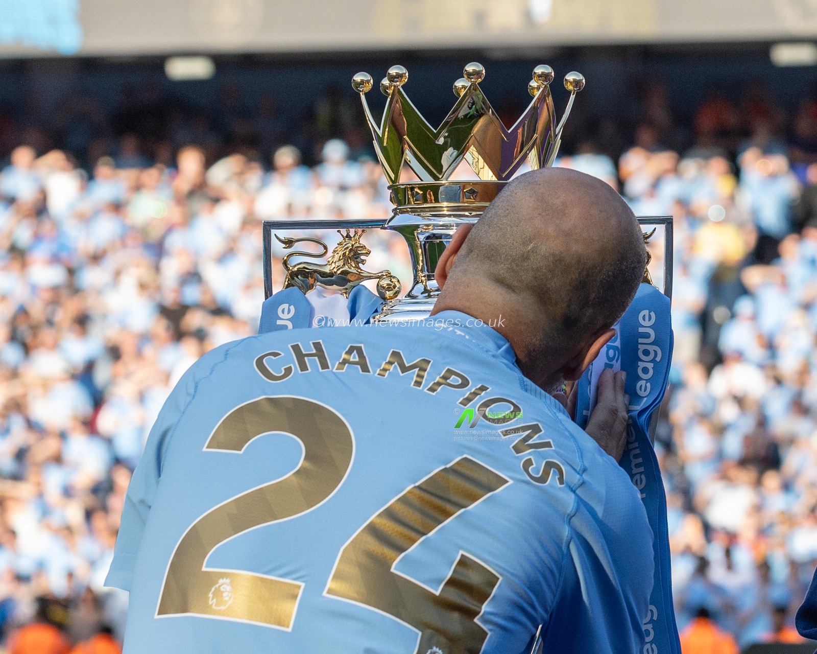 Pep Guardiola manager of Manchester City kisses the Premier League Trophy during the Premier League match Manchester City vs West Ham United at Etihad Stadium, Manchester, United Kingdom, 19th May 2024

(Photo by Mark Cosgrove/News Images)
