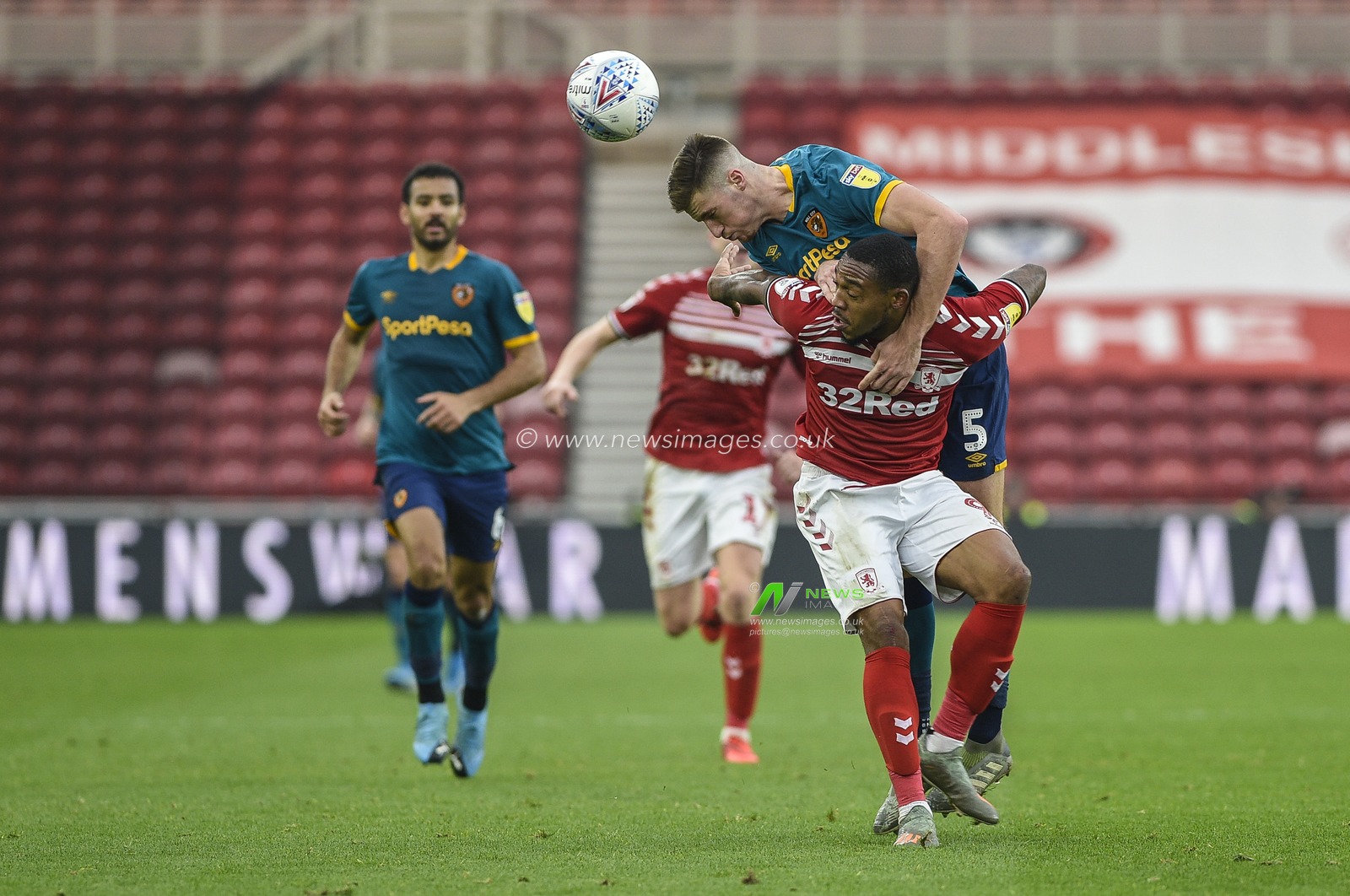 24th November 2019, Riverside Stadium, Middlesbrough, England; Sky Bet Championship, Middlesbrough v Hull City : Reece Burke (5) of Hull City wrestles with Britt Assombalonga (9) of Middlesbrough

Credit: Iam Burn/News Images