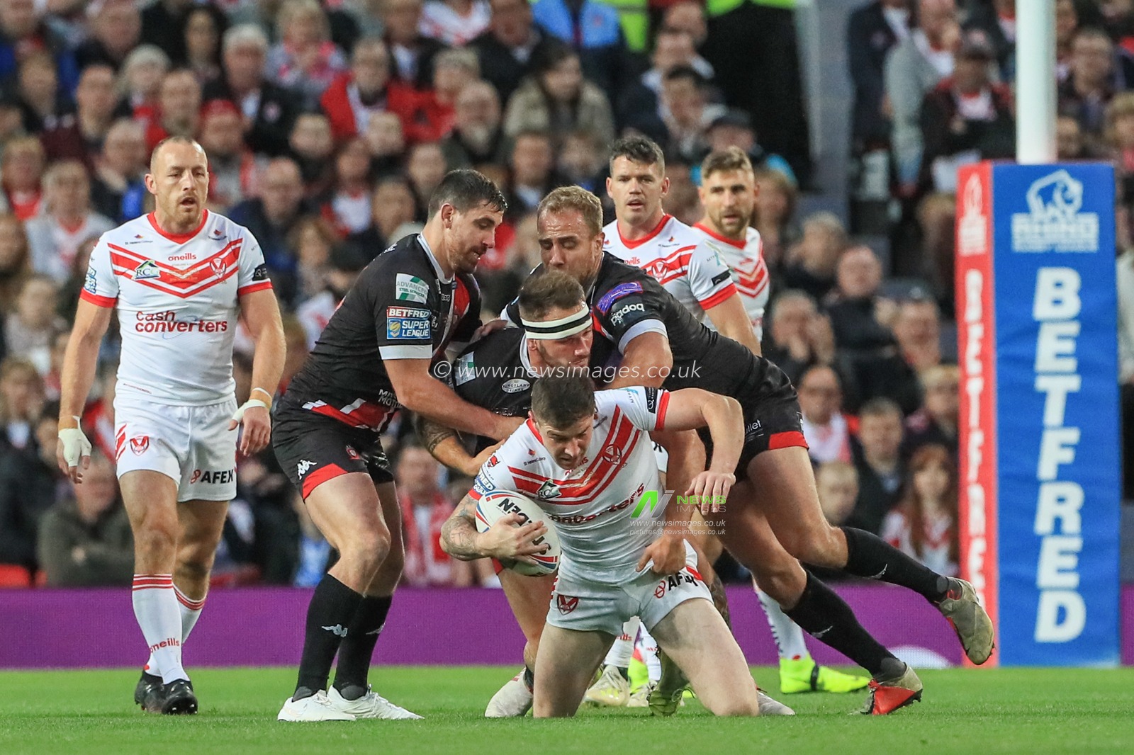 12th October 2019, Old Trafford, Manchester, England; The Grand Final 2019, Saint Helens v Salford Red Devils : Mark Percival (4) of St Helens is tackled by George Griffin (12) of Salford Red Devils 


Credit: Mark Cosgrove/News Images