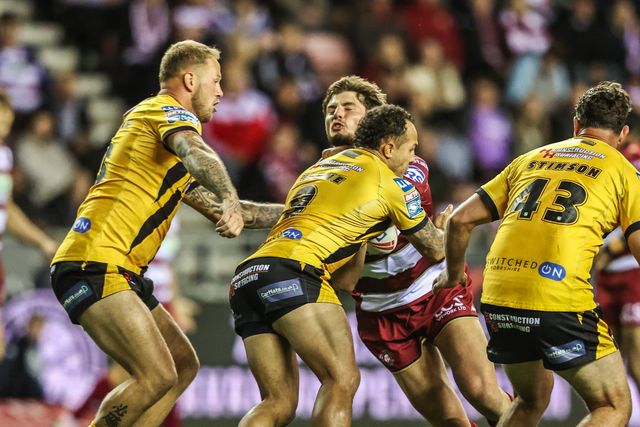 Ethan Havard of Wigan Warriors is tackled by Liam Horne of Castleford Tigers during the Betfred Super League Round 26 match Wigan Warriors vs Castleford Tigers at The Brick Community Stadium, Wigan, United Kingdom, 12th September 2025

(Photo by Alfie Cosgrove/News Images)
