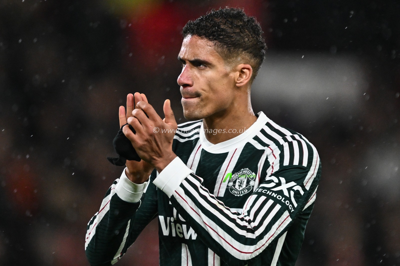 RaphaÃ«l Varane of Manchester United applauds the travelling fans after Manchester United lose 2-1 during the Premier League match Nottingham Forest vs Manchester United at City Ground, Nottingham, United Kingdom, 30th December 2023

(Photo by Craig Thomas/News Images)