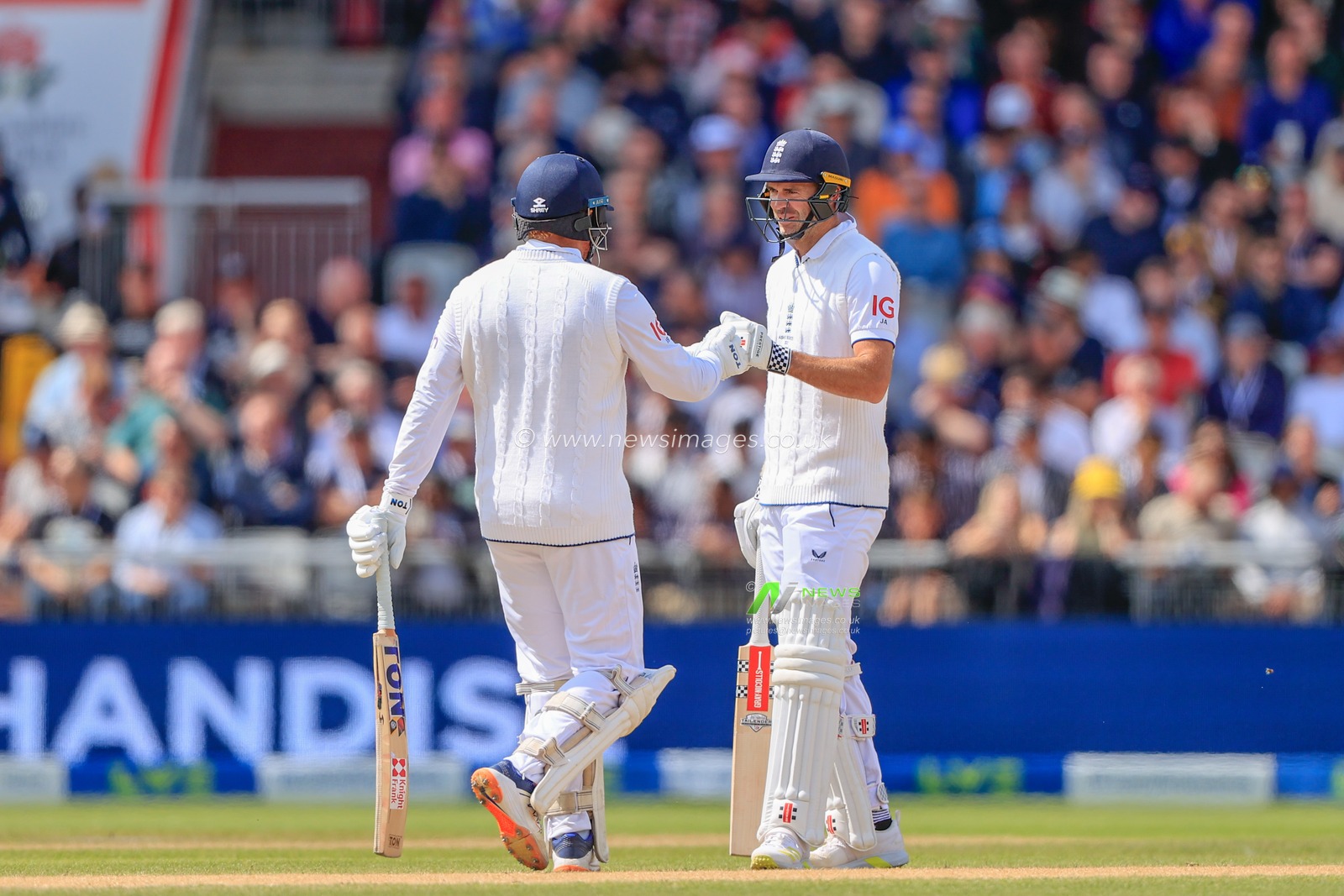 James Anderson of England and Jonny Bairstow of England bump fists during the LV= Insurance Ashes Fourth Test Series Day Three Test Series match England vs Australia at Old Trafford, Manchester, United Kingdom, 21st July 2023

(Photo by Conor Molloy/News Images)