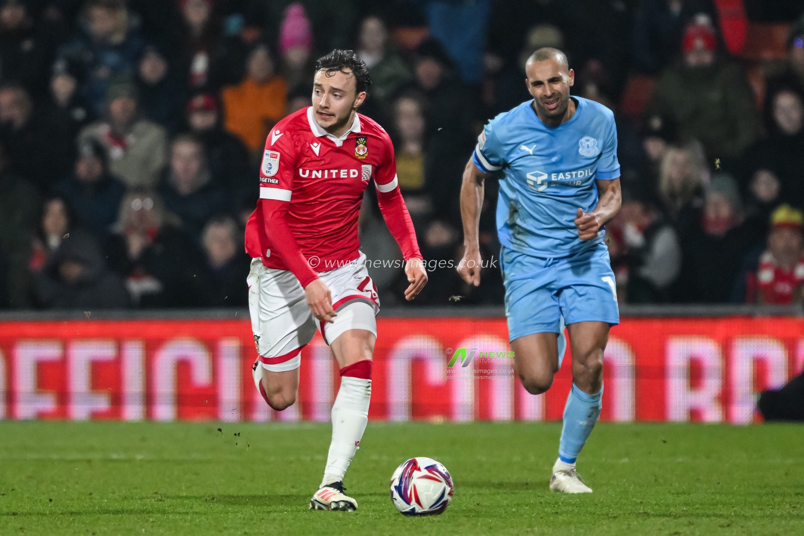 Ollie Rathbone of Wrexham makes a break with the ball during the Sky Bet League 1 match Wrexham vs Leyton Orient at SToK Cae Ras, Wrexham, United Kingdom, 18th February 2025

(Photo by Craig Thomas/News Images)