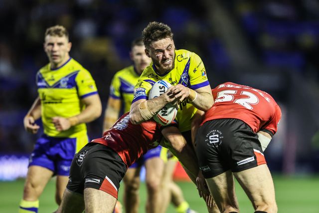 Adam Holroyd of Warrington Wolves is tackled during the Betfred Super League Round 24 match Warrington Wolves vs Salford Red Devils at Halliwell Jones Stadium, Warrington, United Kingdom, 29th August 2025

(Photo by Alfie Cosgrove/News Images)