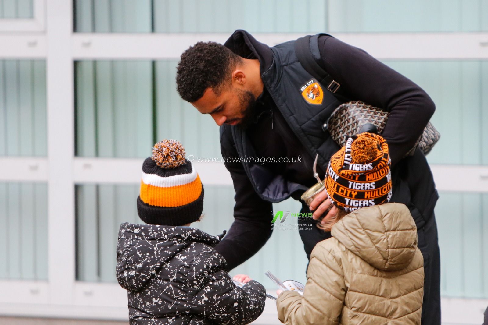 Cyrus Christie #33 of Hull City signs a programme for fans before the Sky Bet Championship match Hull City vs Queens Park Rangers at MKM Stadium, Hull, United Kingdom, 28th January 2023

(Photo by Ben Early/News Images)