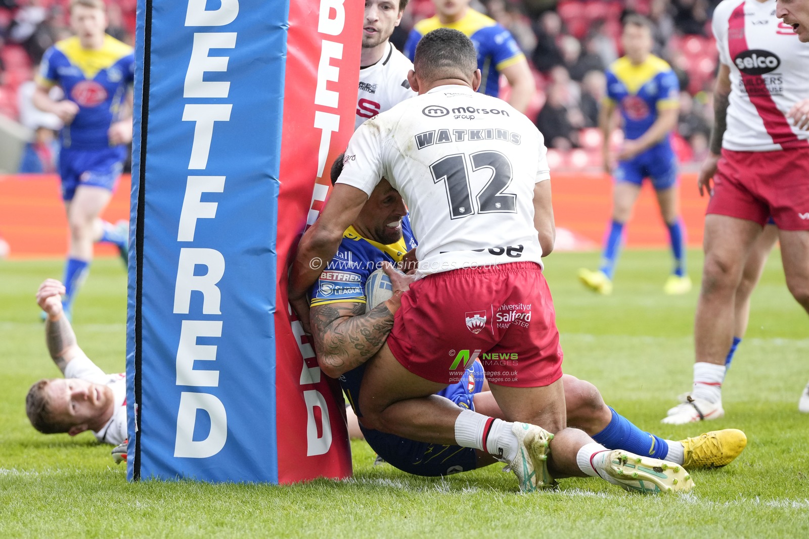 Paul Vaughan of Warrington Wolves drives through the Salford Red Devils defence during the Betfred Super League Round 9 match Salford Red Devils vs Warrington Wolves at Salford Community Stadium, Eccles, United Kingdom, 27th April 2024

(Photo by Steve Flynn/News Images)