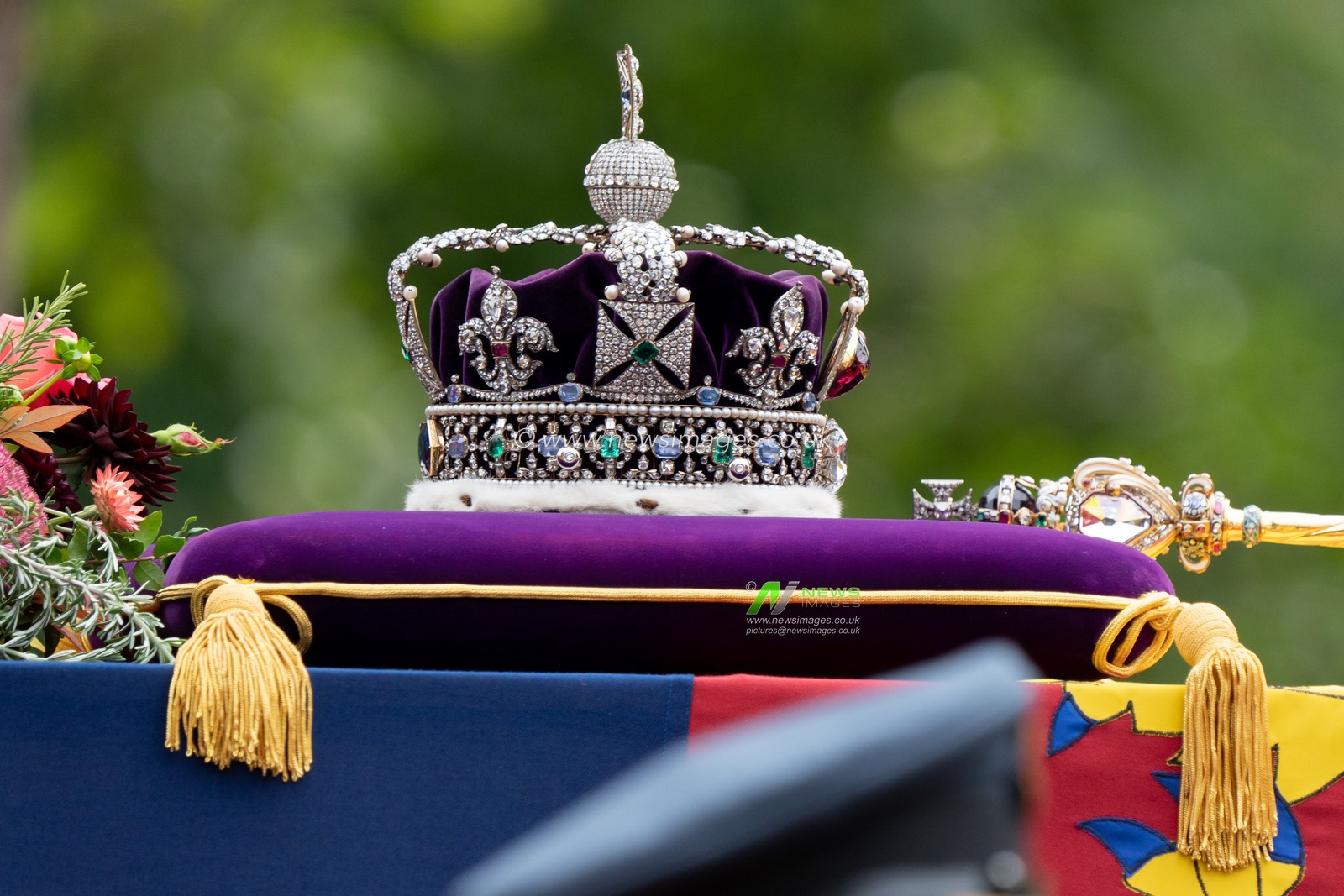 The Imperial Crown rests on the Royal Standard with the Orb and Sceptre on the the coffin of Queen Elizabeth 11 on a State Gun Carriage in the procession after the State Funeral at Westminster Abbey on the mall, in London City Centre, London, United Kingdom, 19th September 2022

(Photo by Richard Washbrooke/News Images).