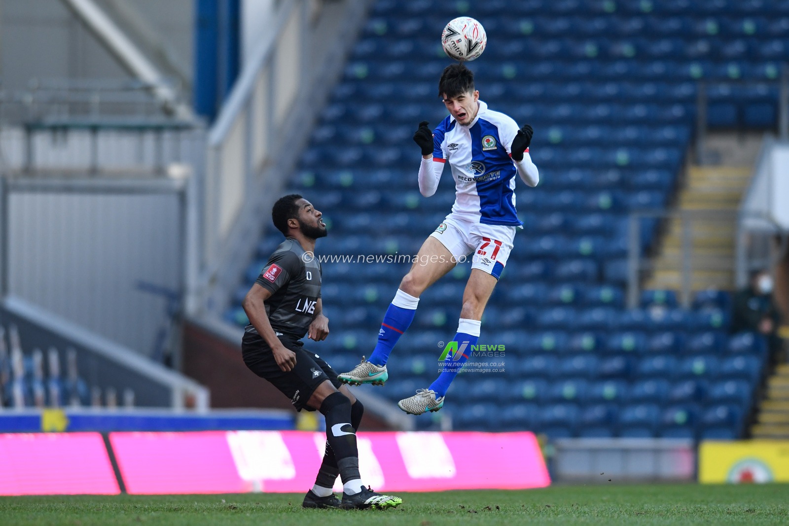 John Buckley #21 of Blackburn Rovers heads the ball