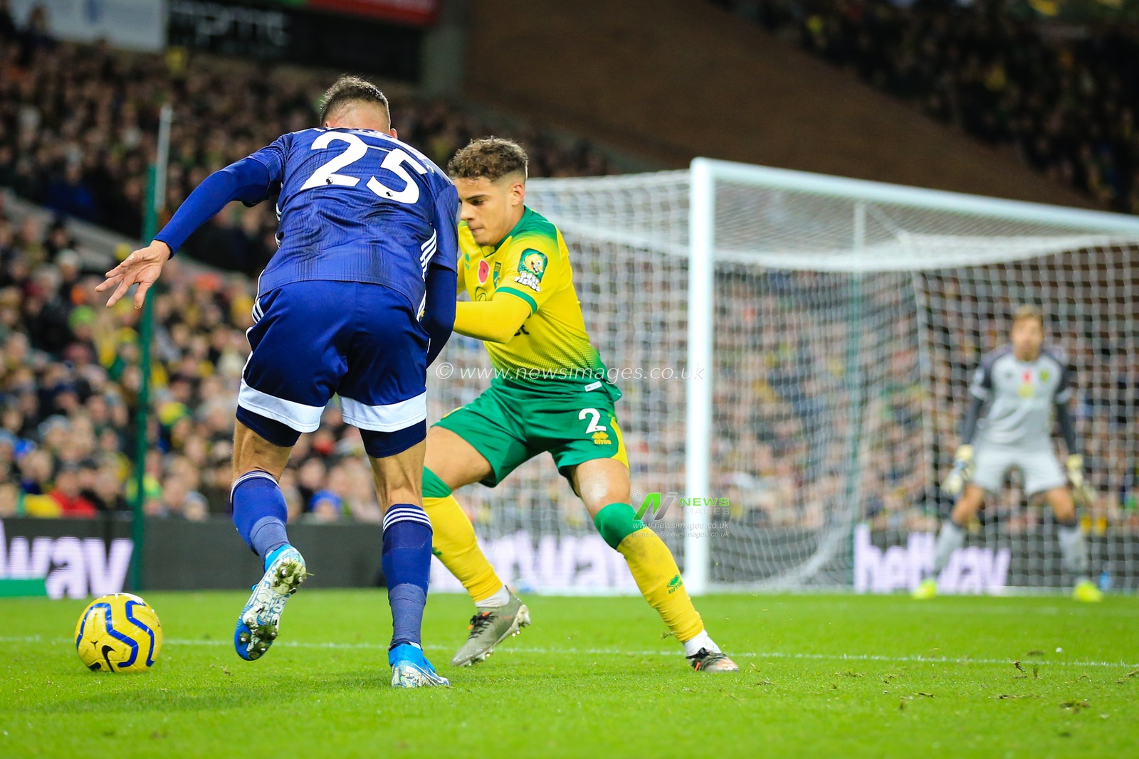 8th November 2019, Carrow Road, Norwich, England; Premier League, Norwich City v Watford : Max Aarons (02) of Norwich City eyes the ball under Jose Holebas (25) of Watford 

Credit: Georgie Kerr/News Images