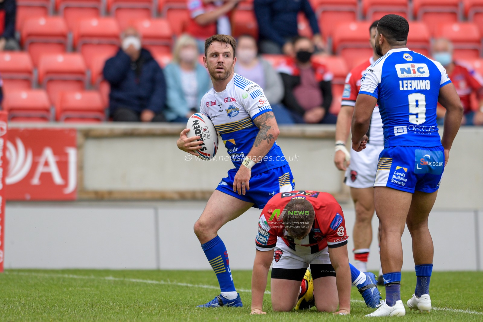 Richie Myler (16) of Leeds Rhinos celebrates scoring a try to make it 8-14