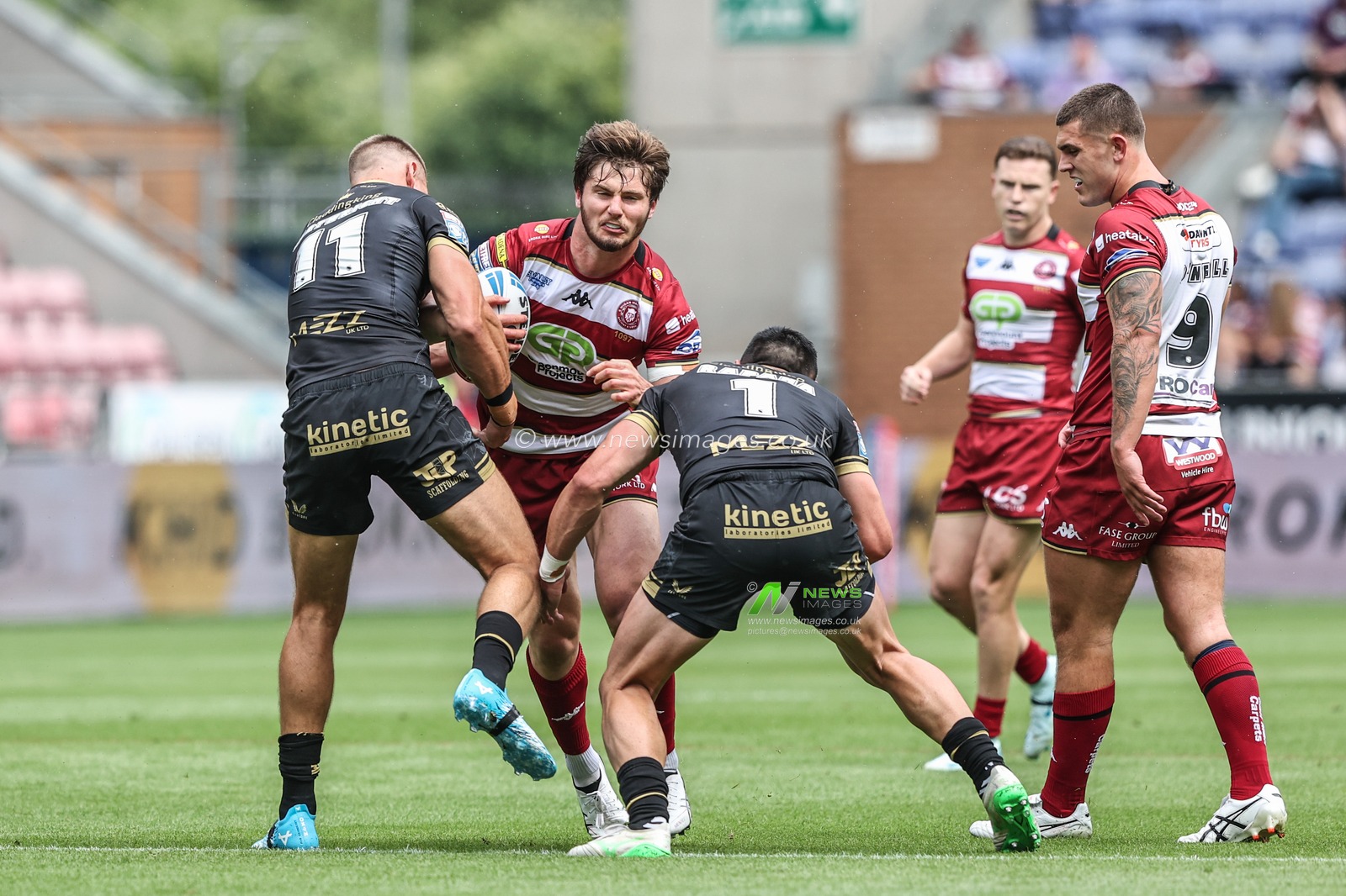 Ethan Havard of Wigan Warriors is tackled during the Betfred Super League Round 19 match Wigan Warriors vs Hull FC at The Brick Community Stadium, Wigan, United Kingdom, 19th July 2025

(Photo by Alfie Cosgrove/News Images)