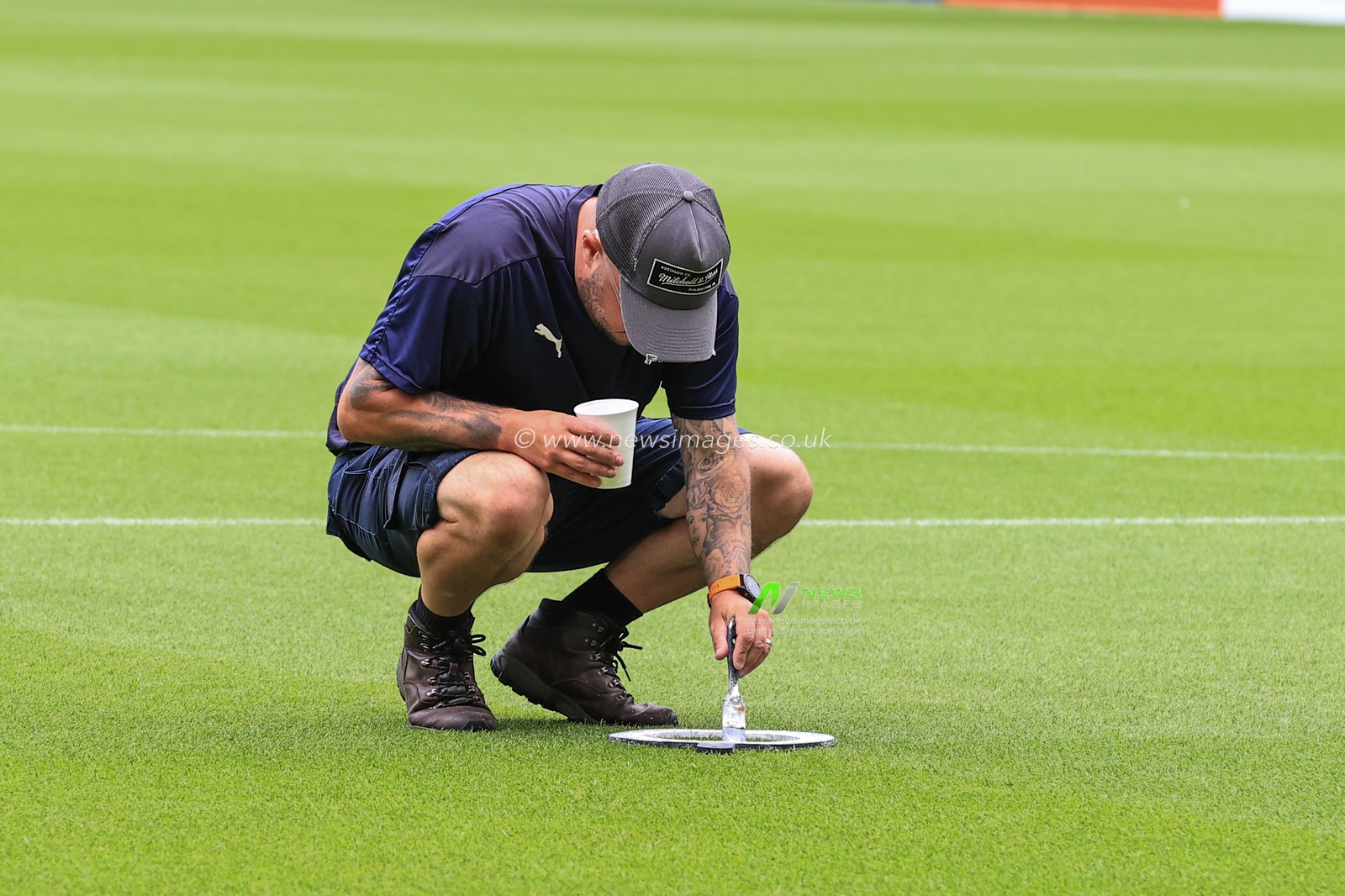 Ground staff prepare the pitch for this afternoons Sky Bet Championship game, Blackpool v Cardiff City