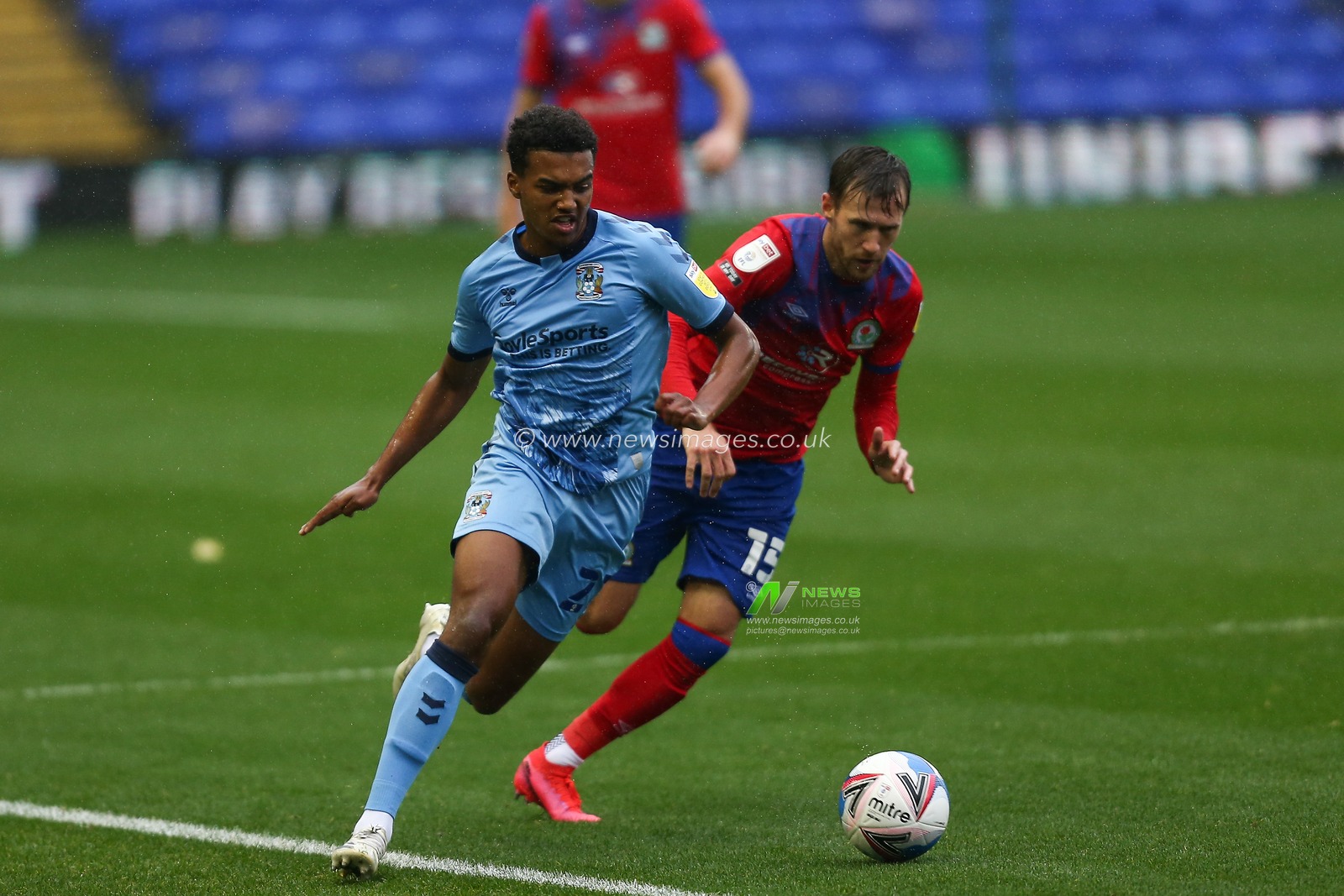 Sam McCallum (21) of Coventry City  dribbles the ball away from Barry Douglas (15) of Blackburn Rovers