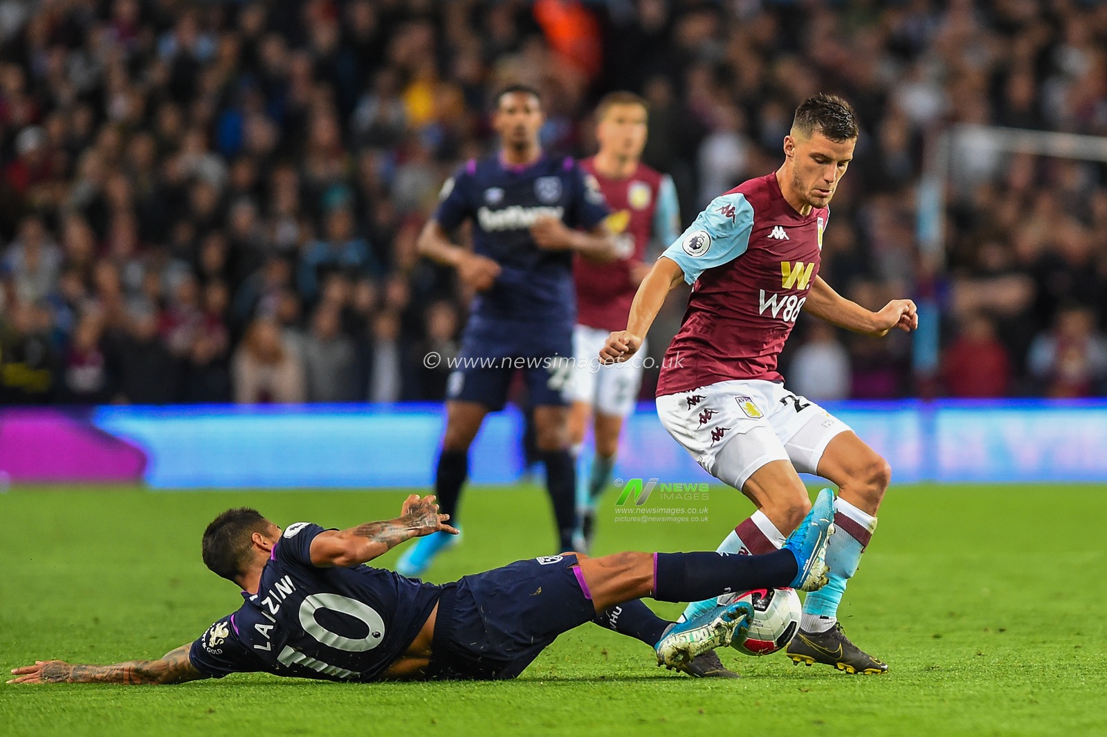 16th September 2019, Villa Park, Birmingham, England ; Premier League Football, Aston Villa vs West Ham ; Frederic Guilbert (24) of Aston Villa is tackled by Manuel Lanzini of West Ham

Credit: Gareth Dalley/News Images

English Football League images are subject to DataCo Licence