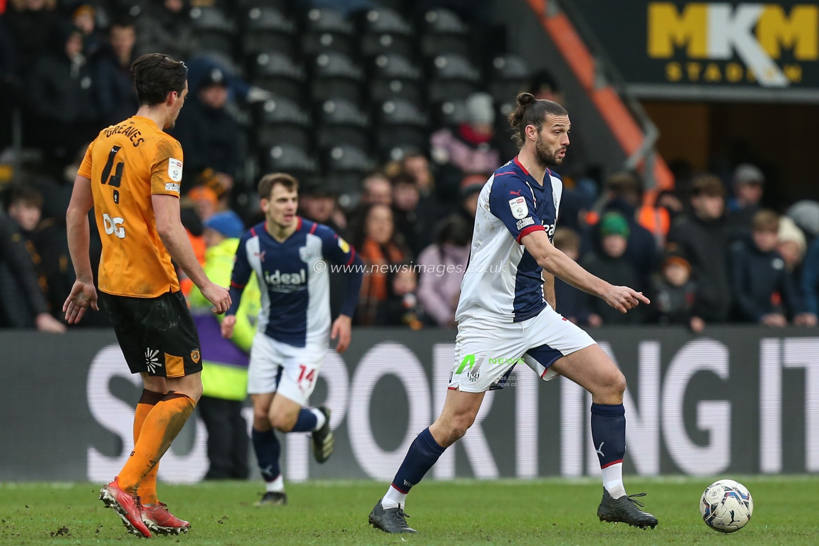 Andy Carroll #15 of West Bromwich Albion looks t5o pass the ball