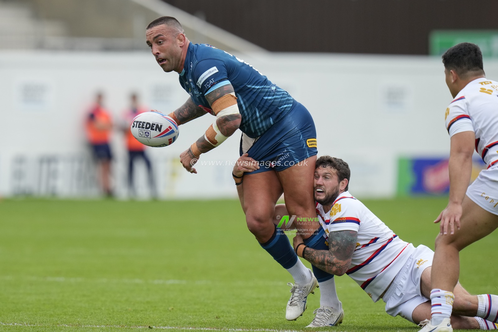 Paul Vaughan #10 of Warrington Wolves looks to offload the ball during the Betfred Super League Round 20 match Wakefield Trinity vs Warrington Wolves at The Be Well Support Stadium, Wakefield, United Kingdom, 30th July 2023

(Photo by Steve Flynn/News Images)