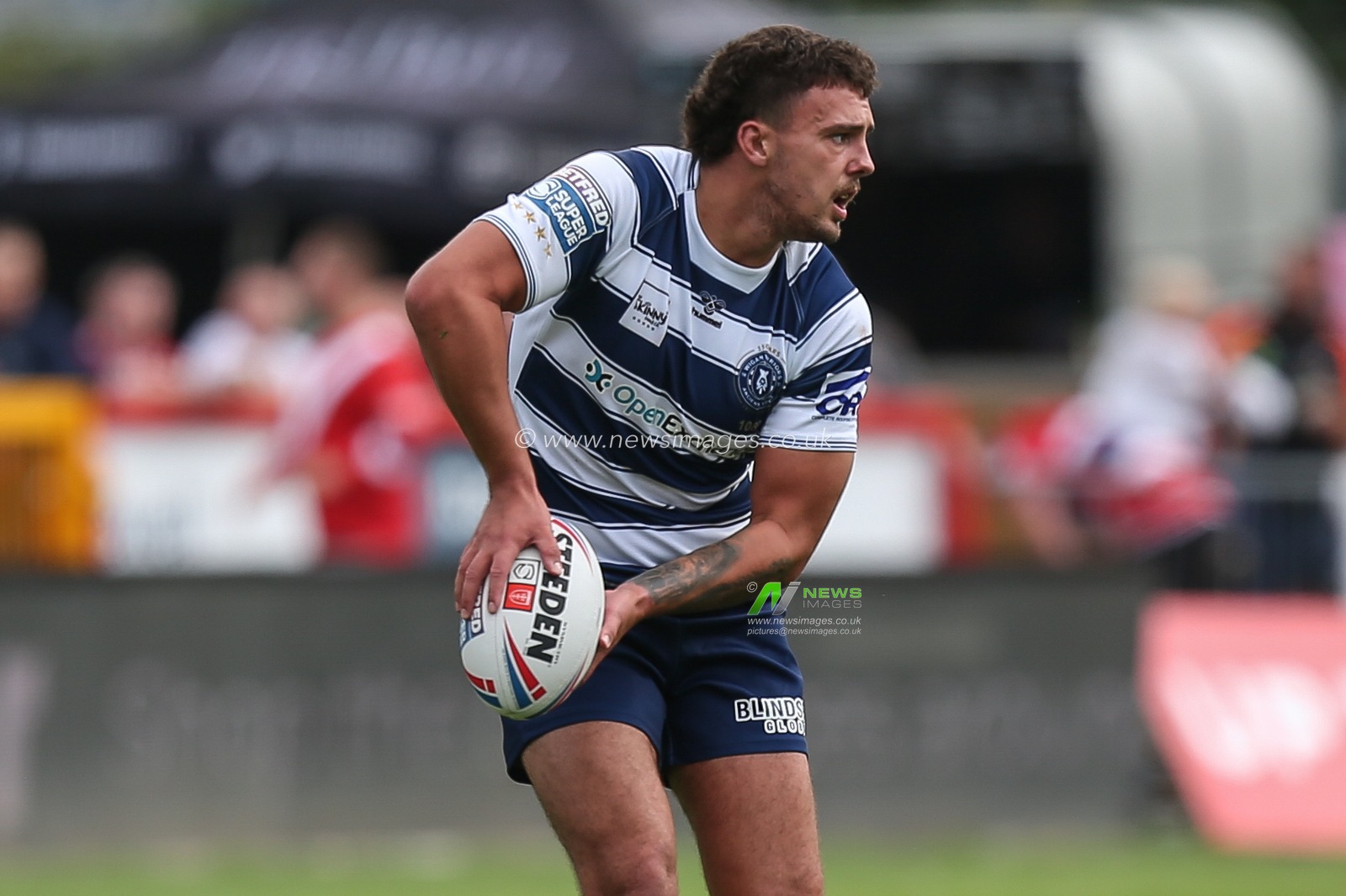Oliver Partington #17 of Wigan Warriors in action during the game